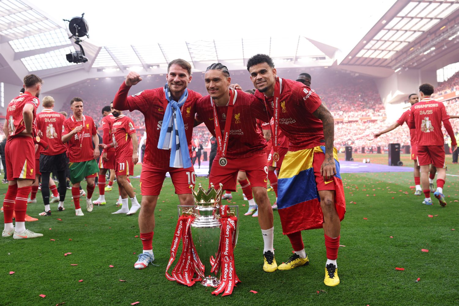 Luis Diaz, Darwin Nunez and Alexis Mac Allister pose with the Premier League trophy