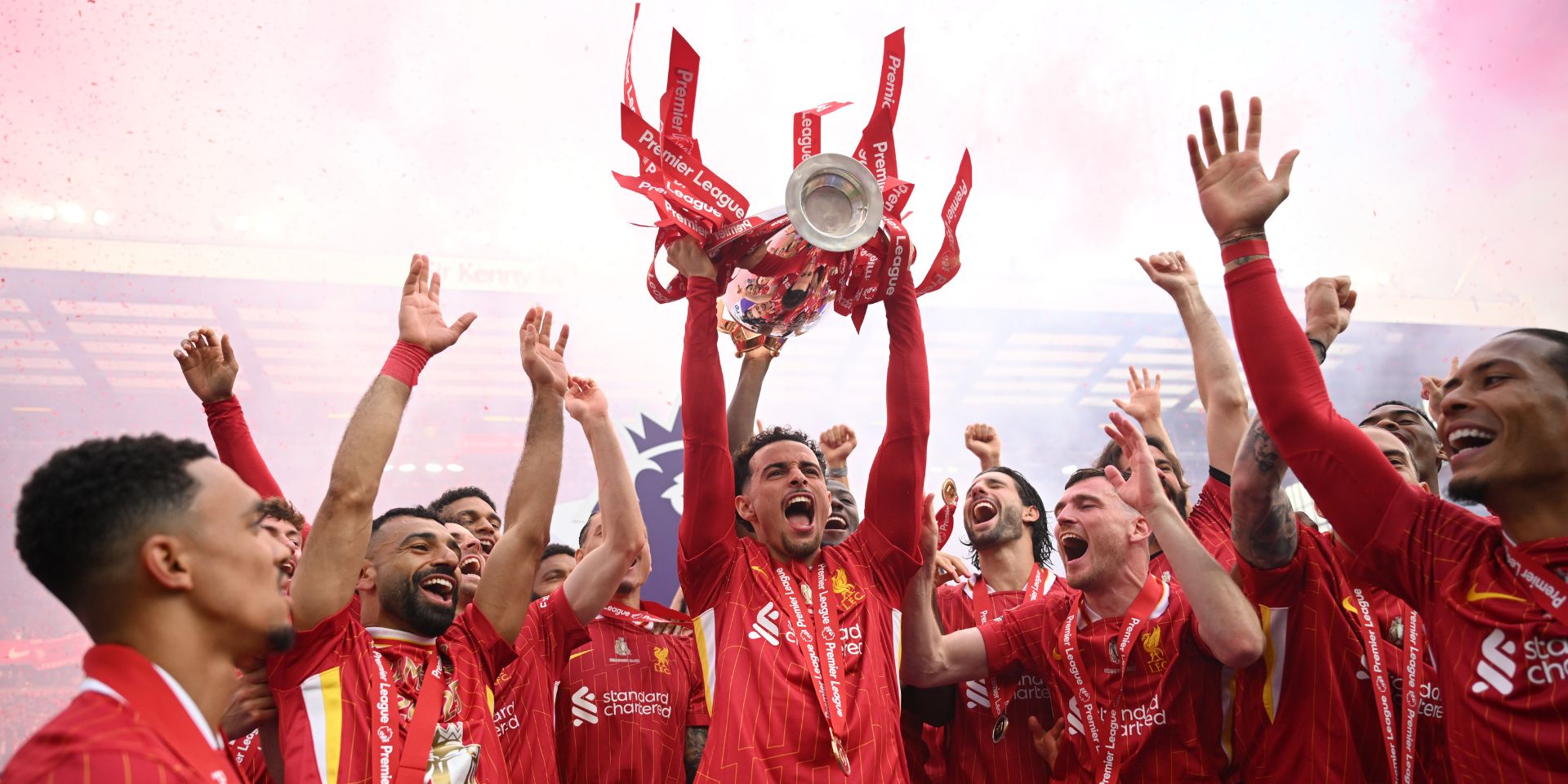 Curtis Jones lifts the Premier League title