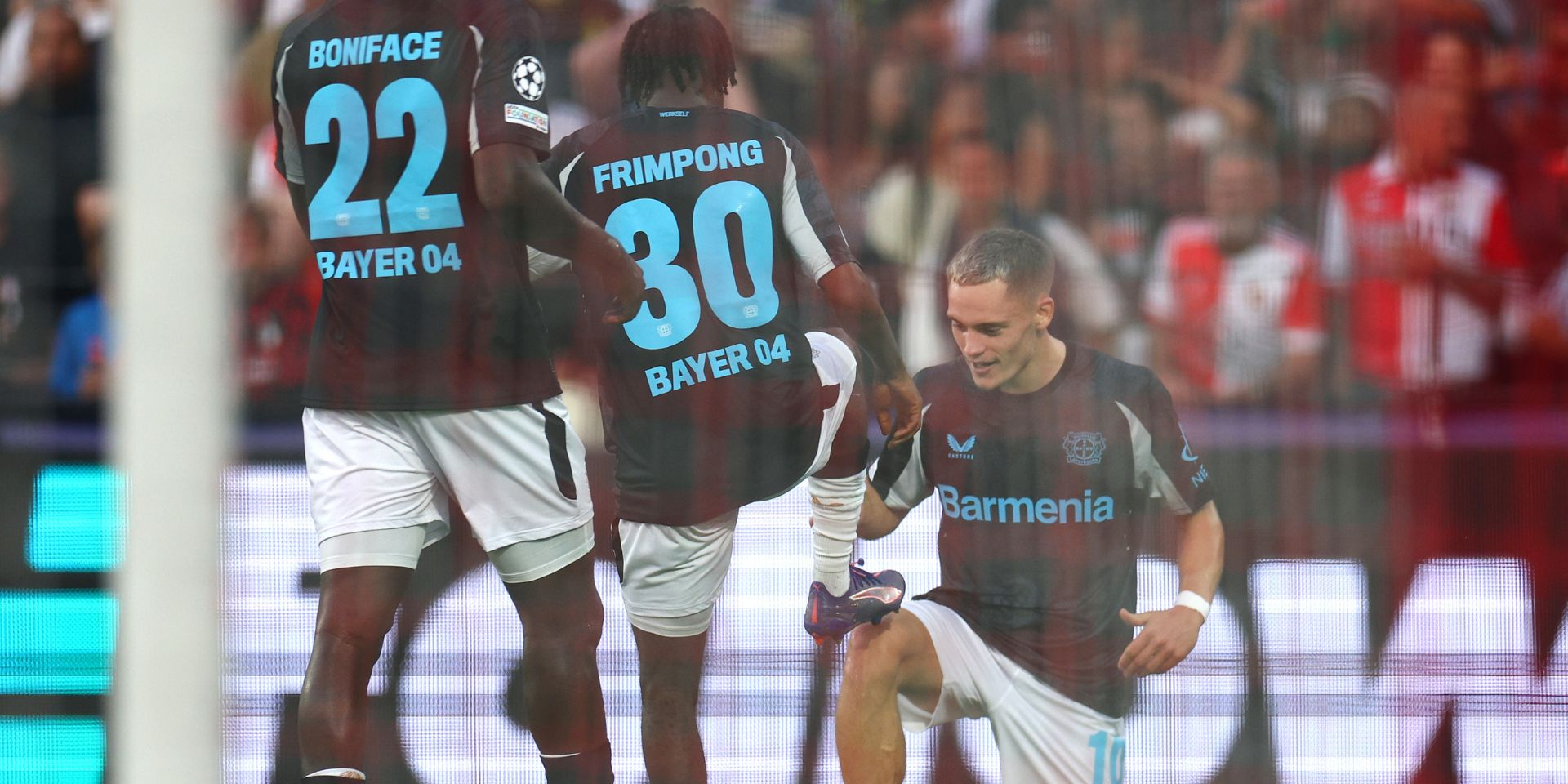 Florian Wirtz and Jeremie Frimpong celebrate for Leverkusen