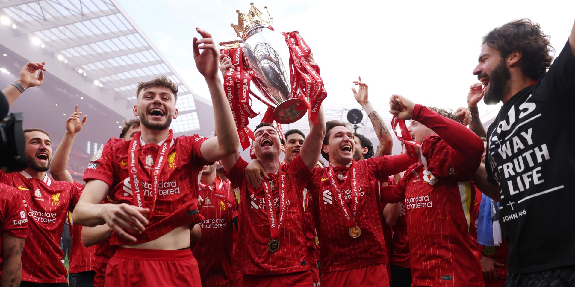 Andy Robertson celebrates with the Premier League title