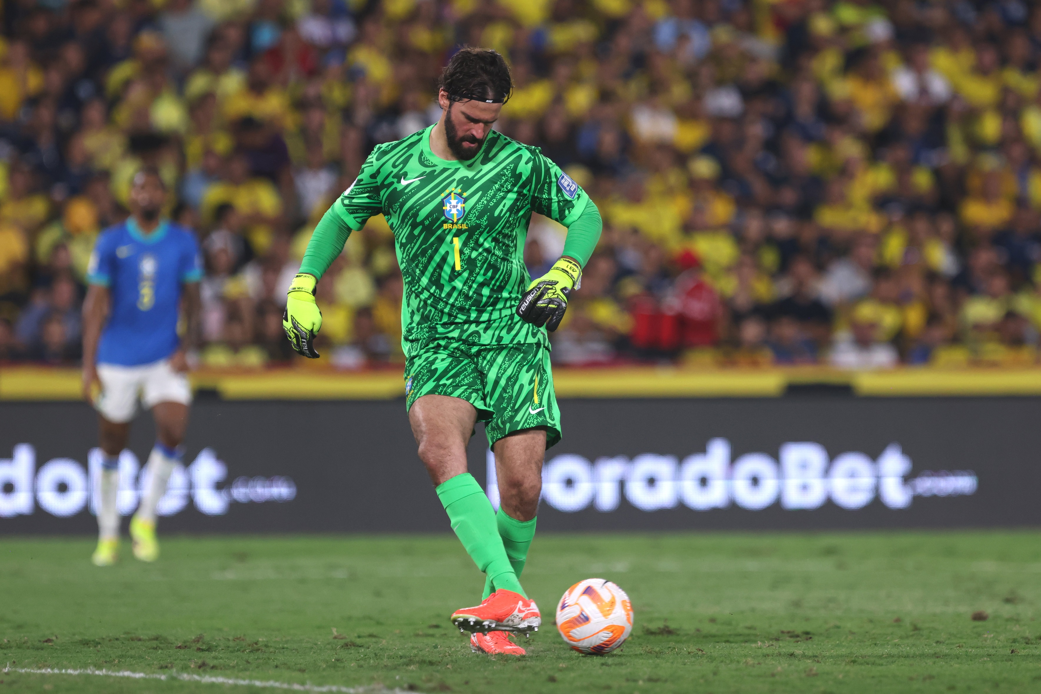 Alisson Becker kicks the ball whilst in goal for Brazil.
