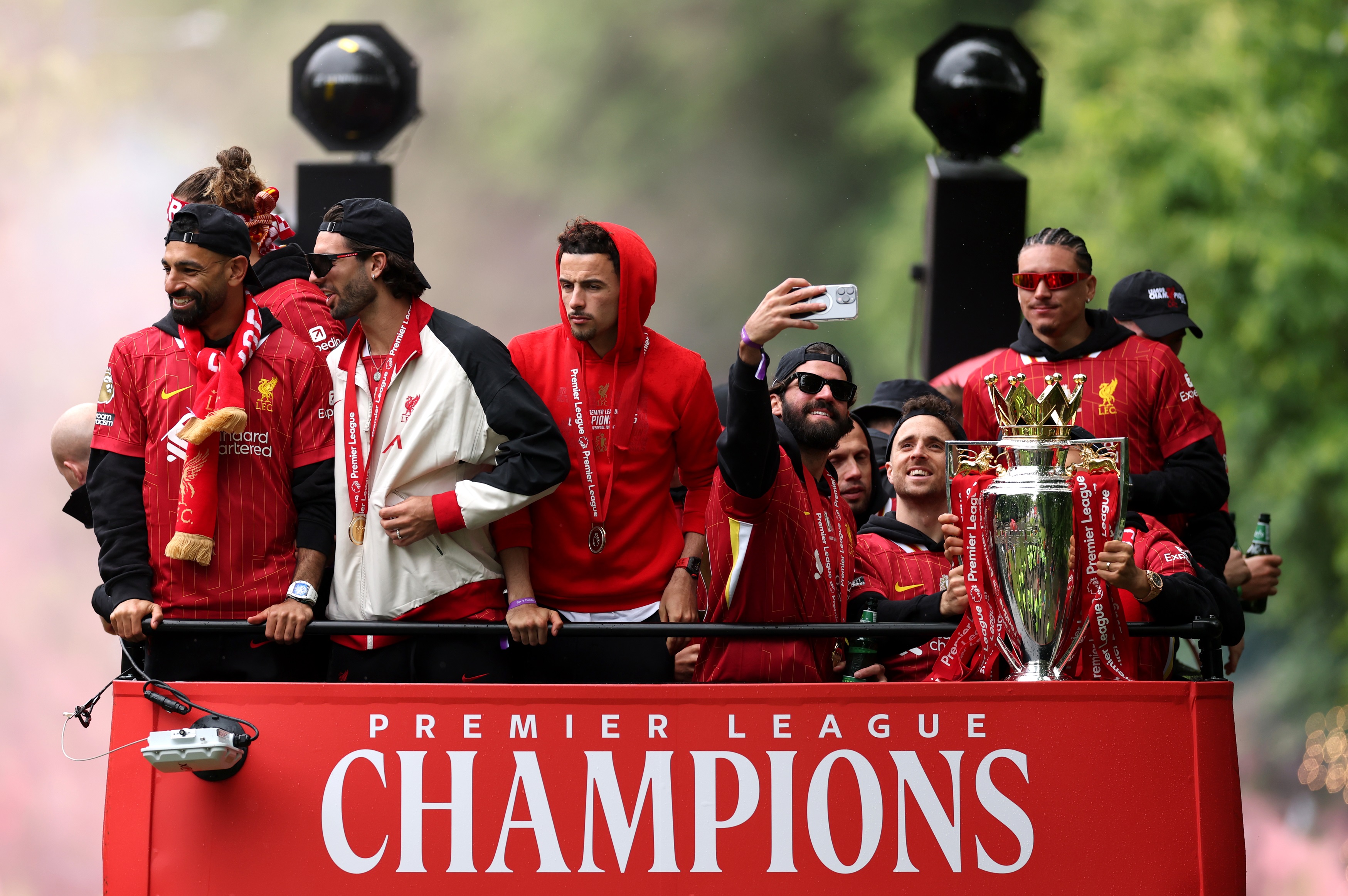 Darwin Nunez stands on Liverpool's open-top bus with fellow Reds.