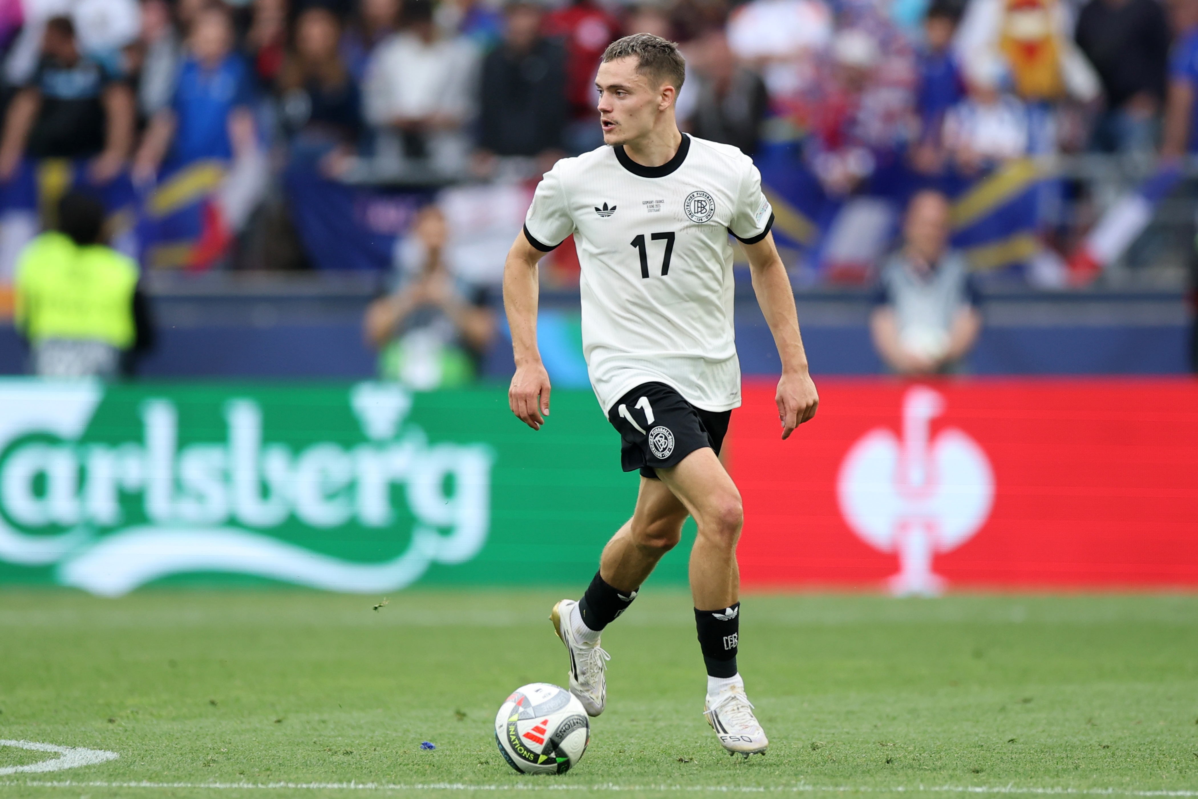 Florian Wirtz dribbles with the ball for Germany.
