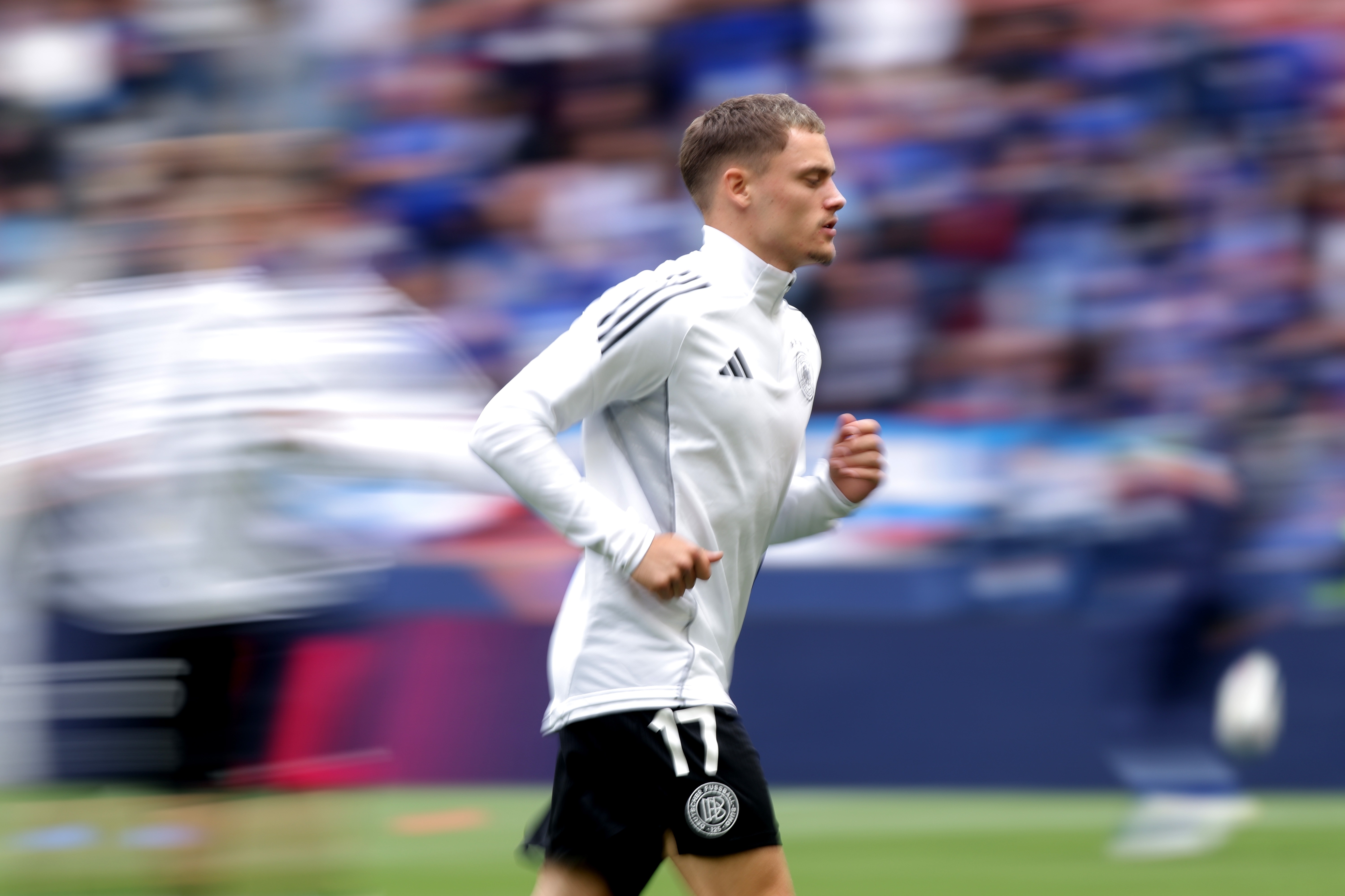 Florian Wirtz runs on the pitch.