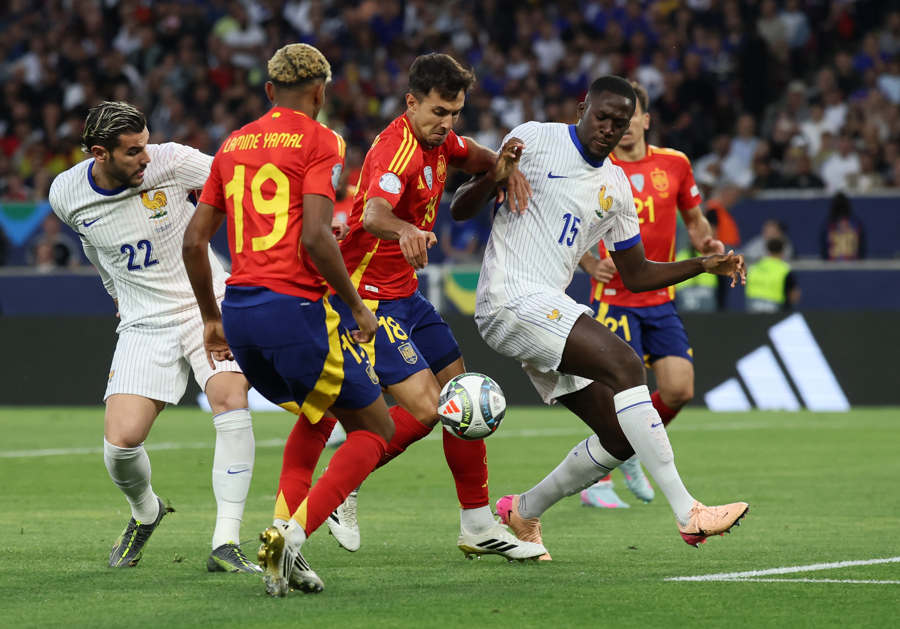 Ibrahima Konate involved in a tangle with Spain players.