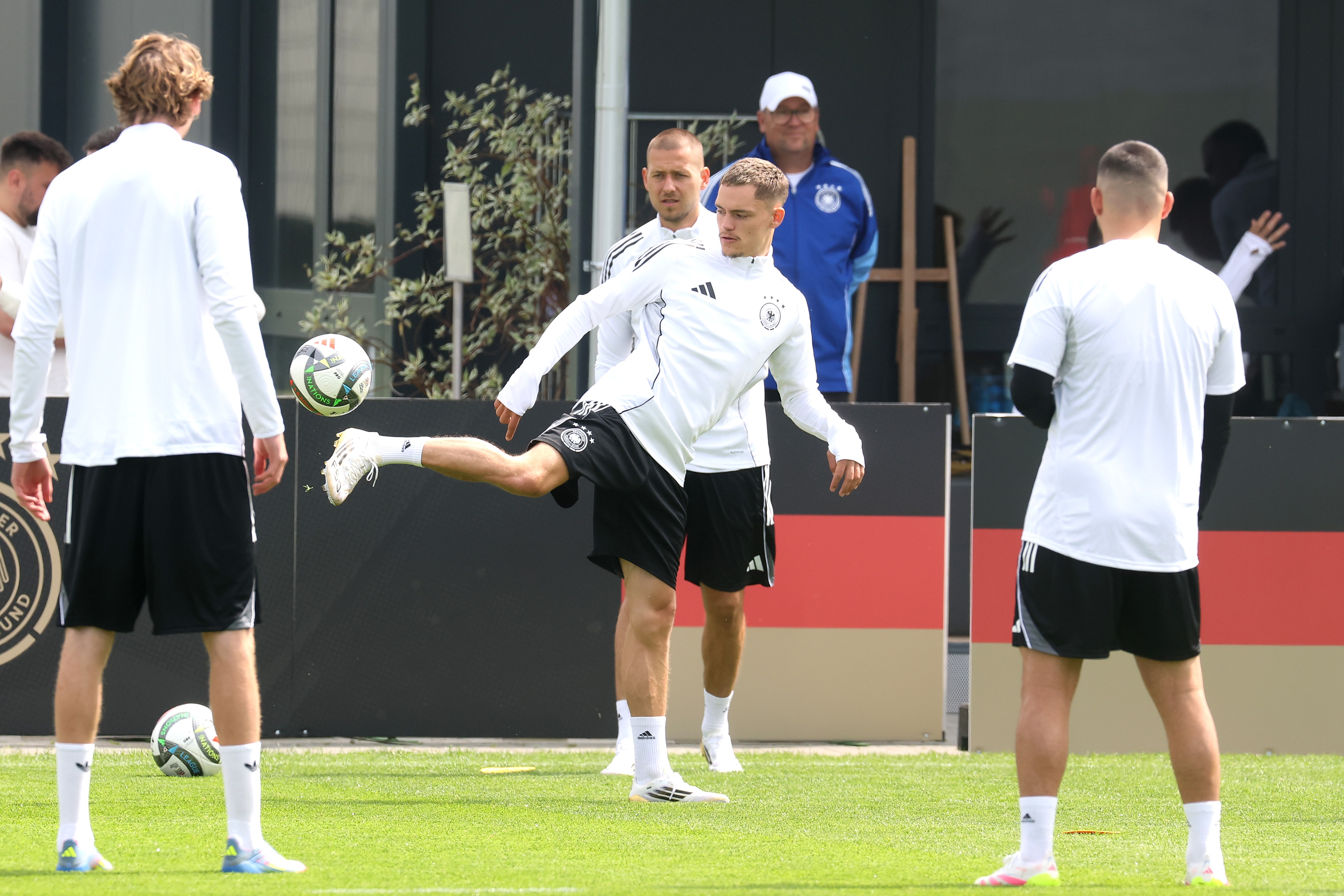 Florian Wirtz kicks a ball during Germany training.