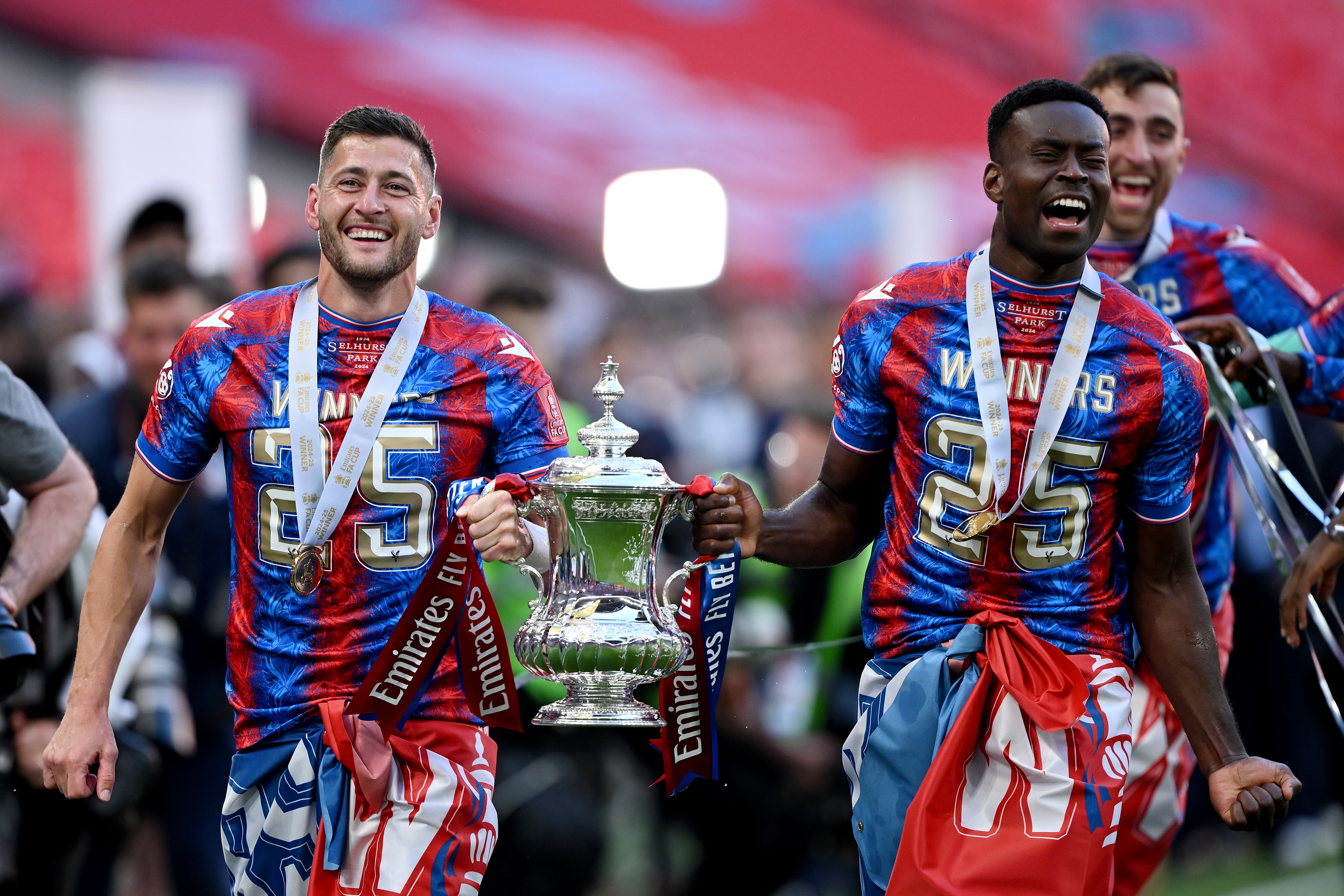 Marc Guehi laughs as he holds FA Cup trophy with Joel Ward.