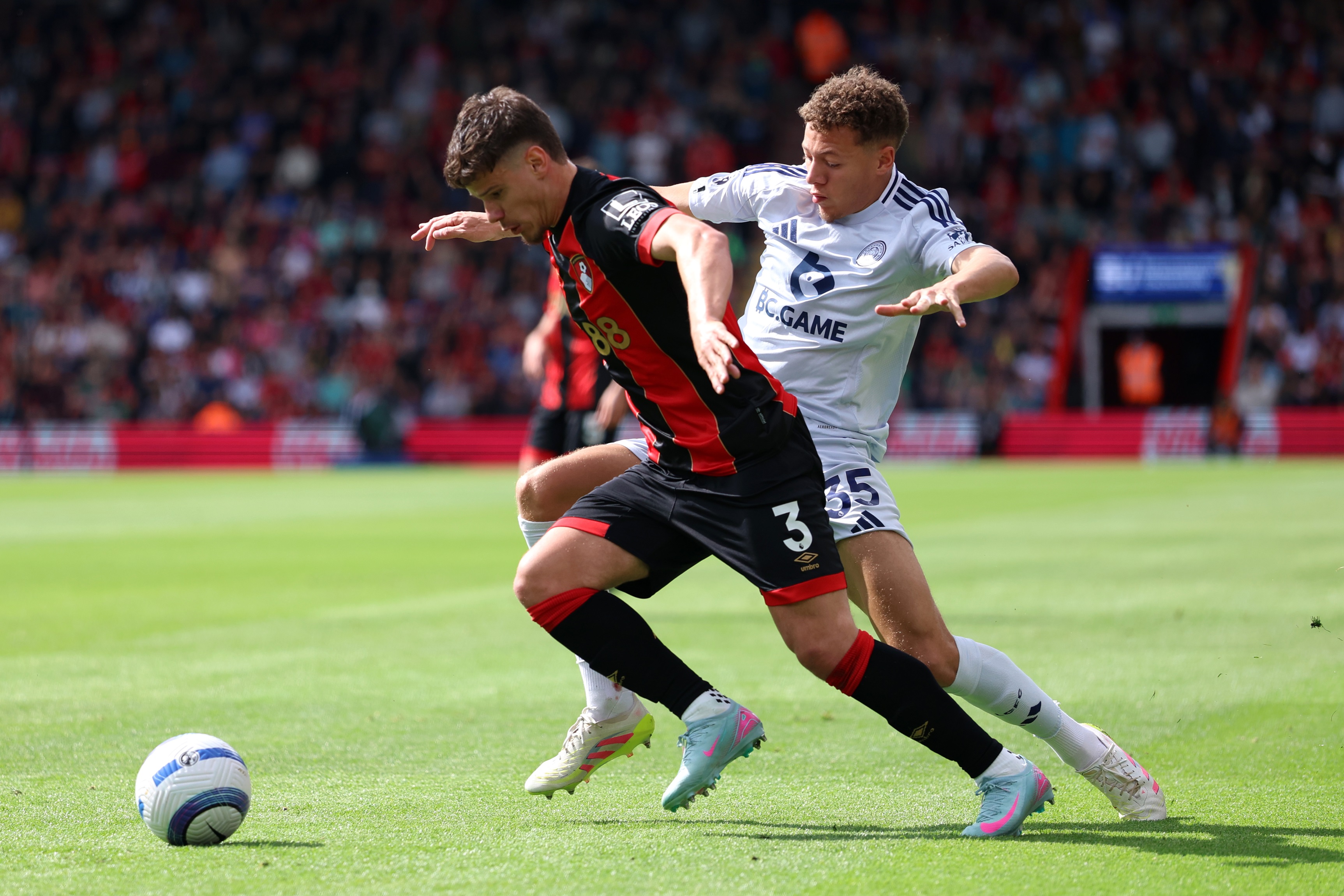 Milos Kerkez dribbles past Kasey McAteer.