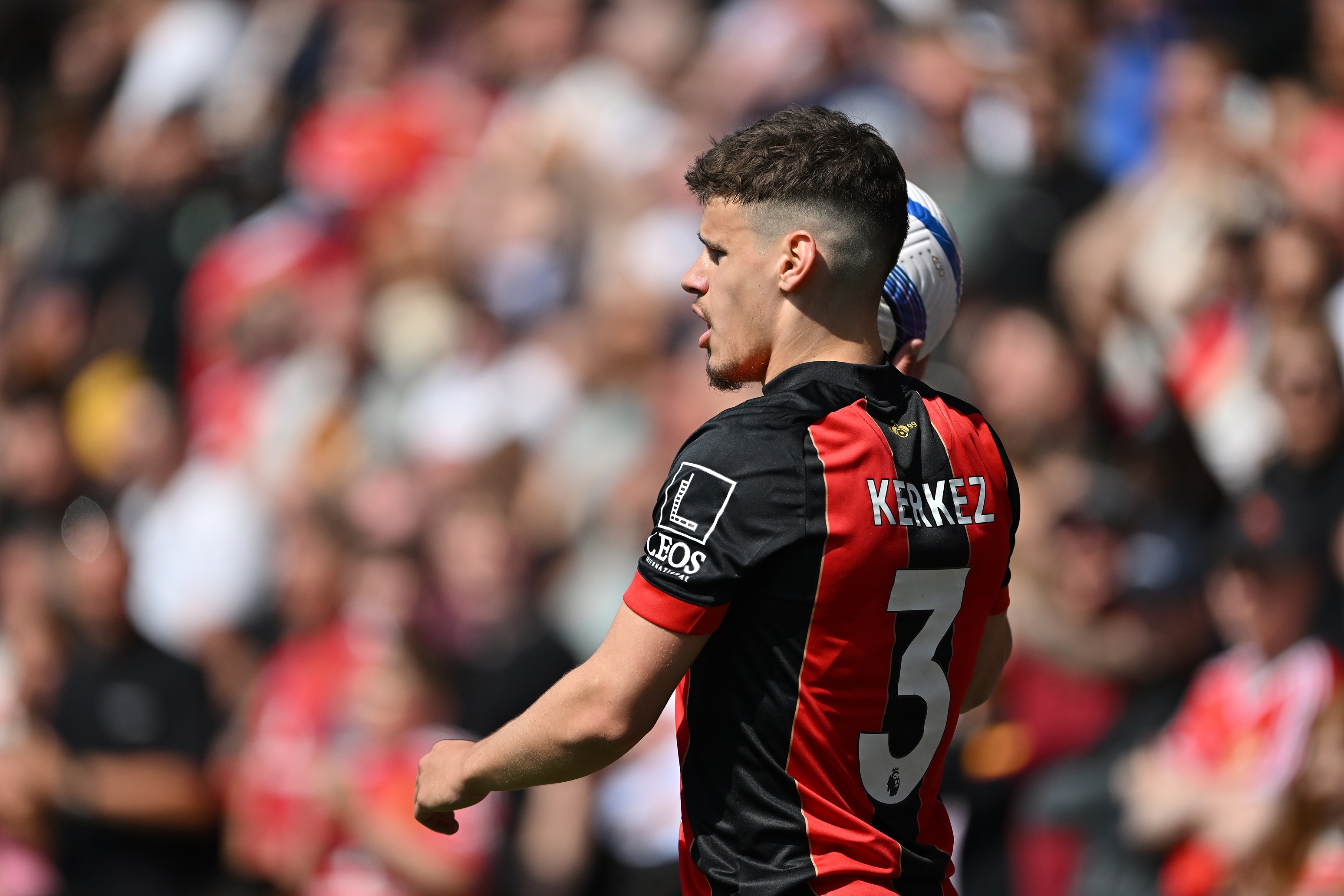 Milos Kerkez lifts the ball ahead of a throw-in.