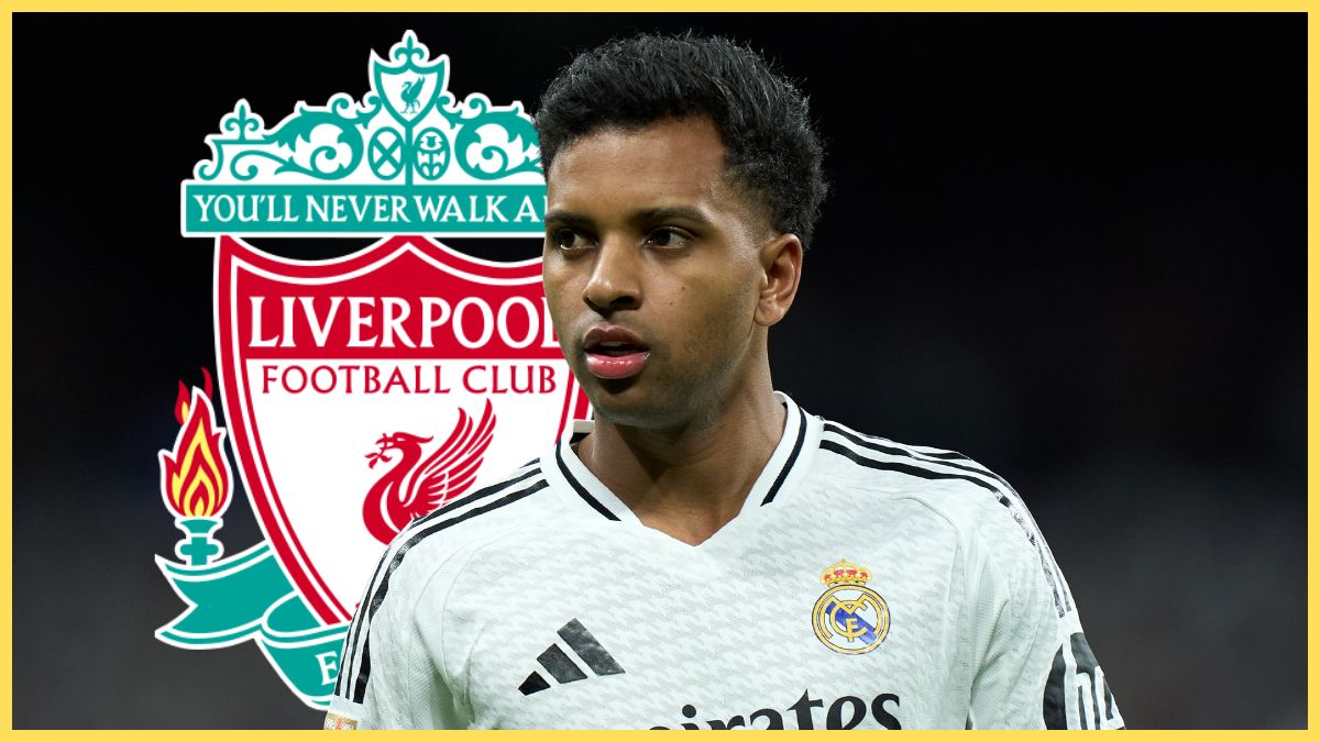 Rodrygo stands in front of Liverpool club crest.