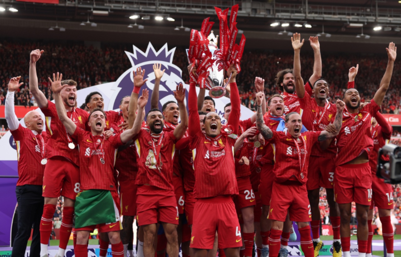 Liverpool players celebrate after being presented with the Premier League trophy