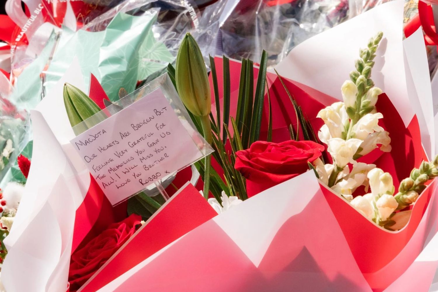 Andy Robertson lays flowers at Anfield in tribute to Diogo Jota