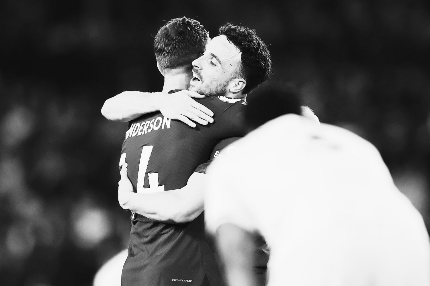 Jordan Henderson and Diogo Jota embrace