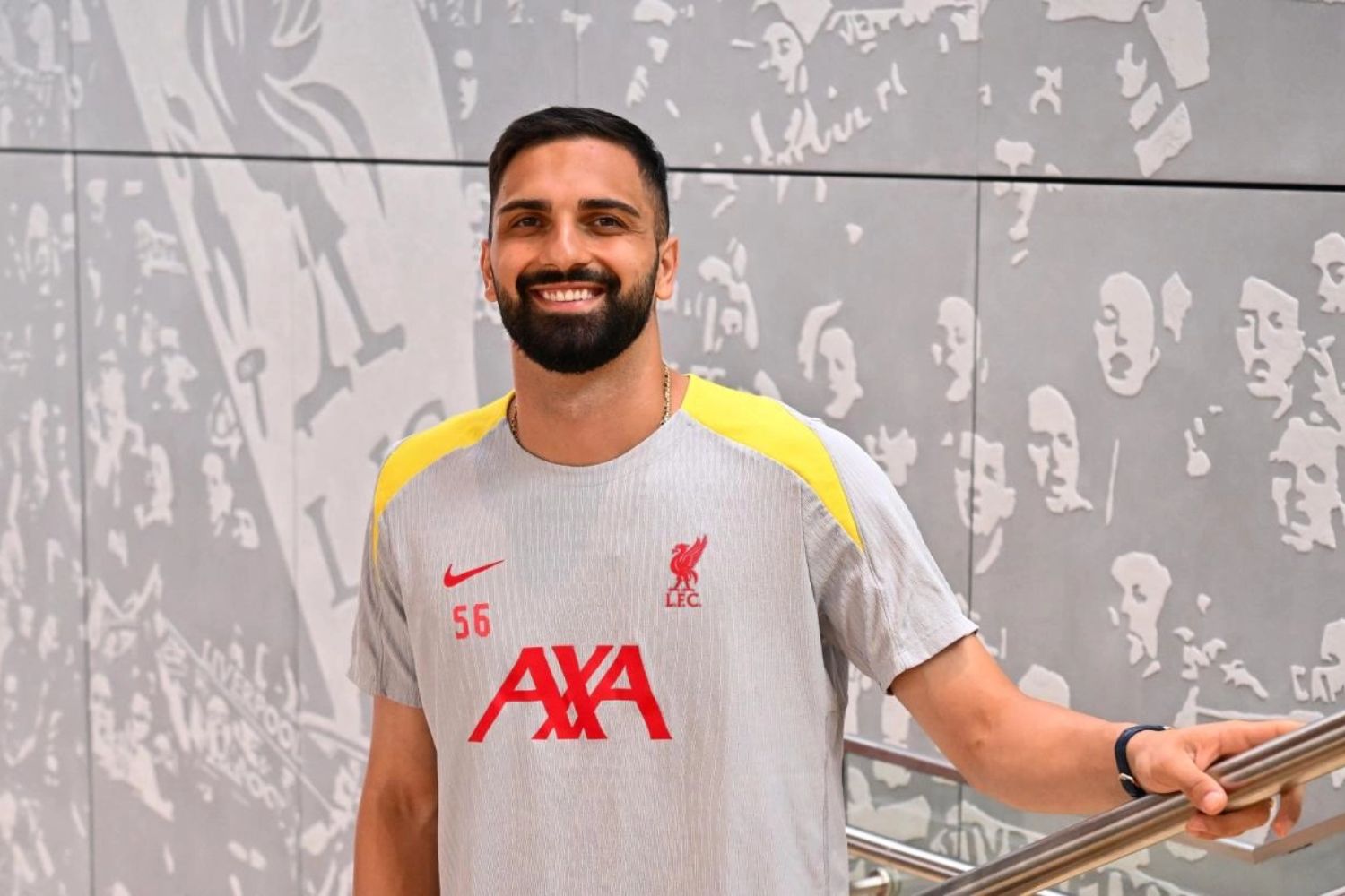 Giorgi Mamardashvili posing in a Liverpool training kit