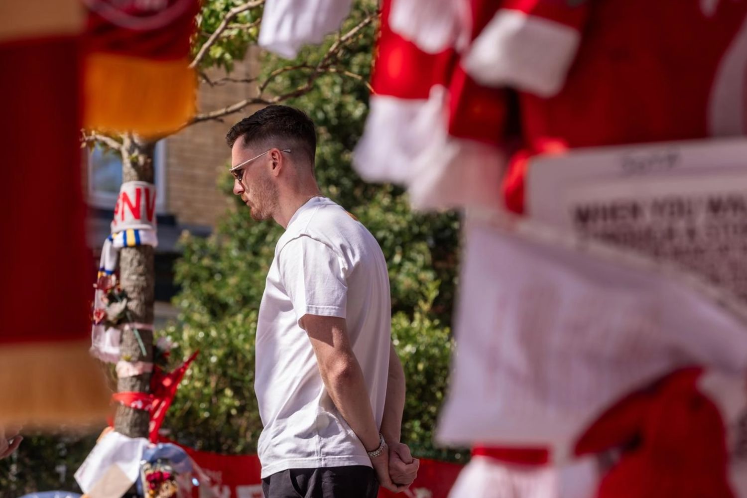 Andy Robertson lays flowers at Anfield in tribute to Diogo Jota