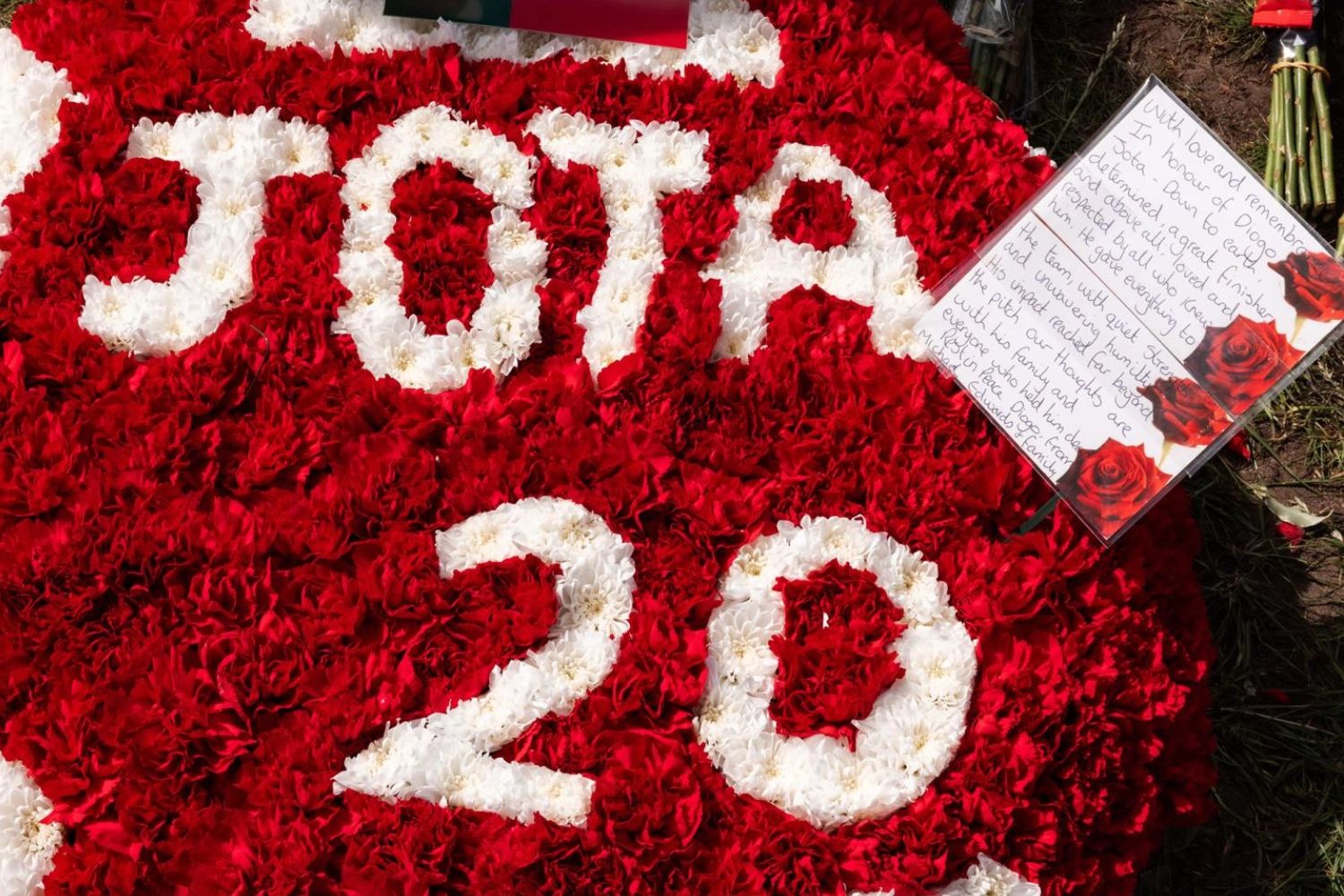 Michael Edwards lays flowers at Anfield in tribute to Diogo Jota