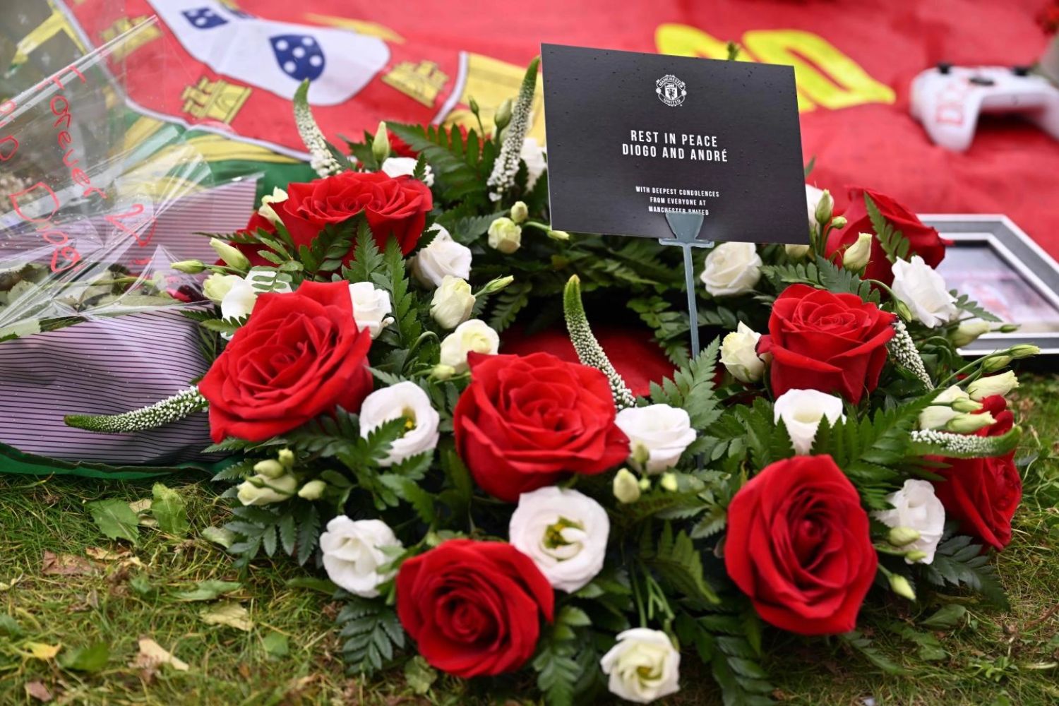 Ruben Amorim, Bruno Fernandes and Diogo Dalot lay flowers on behalf of Manchester United at the Diogo Jota memorial at Anfield
