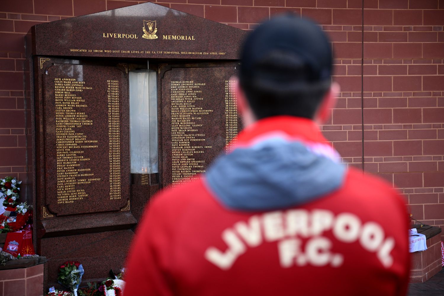 A Liverpool fan visits the Hillsborough memorial