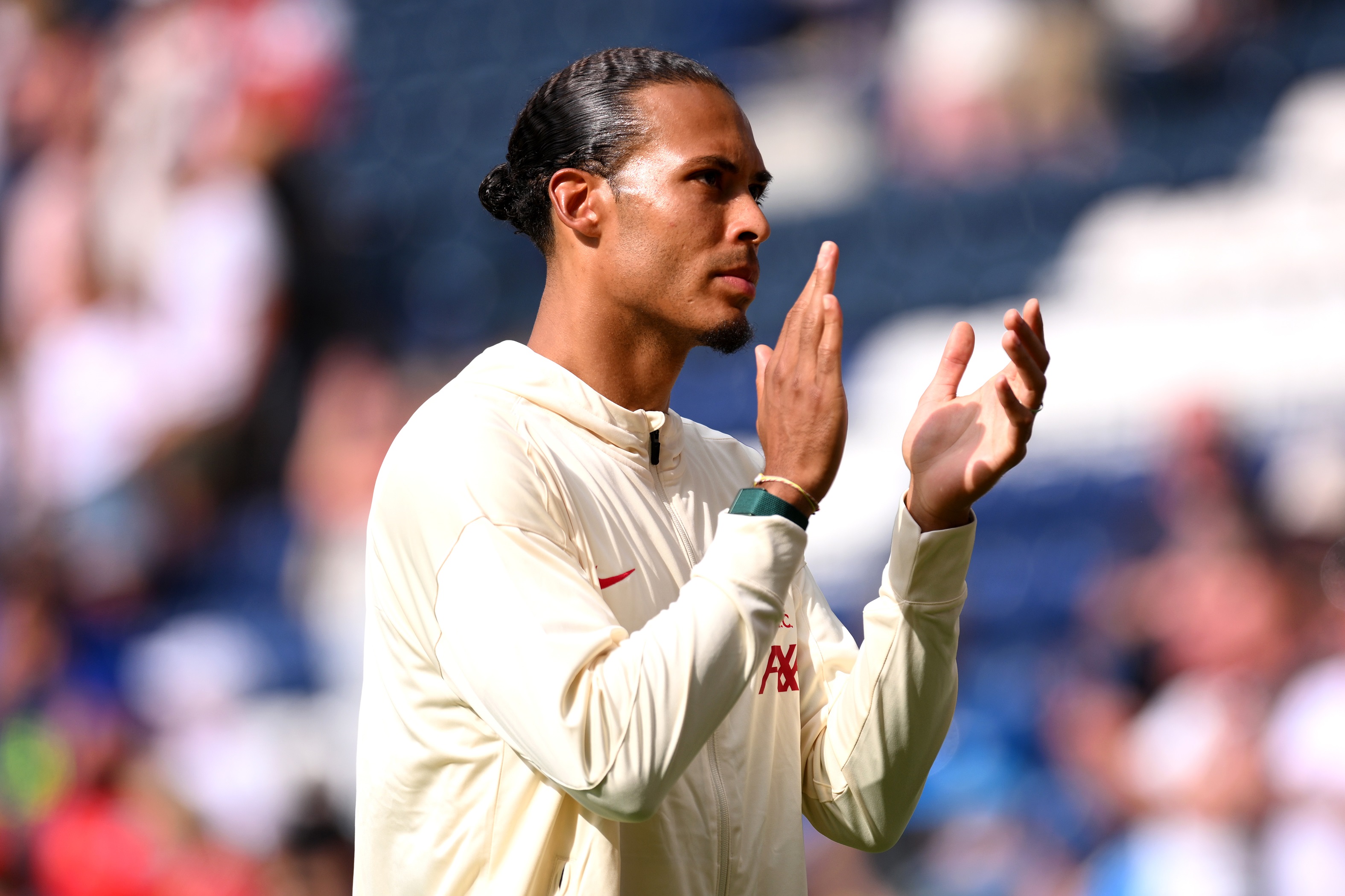 Virgil van Dijk applauds Liverpool fans.
