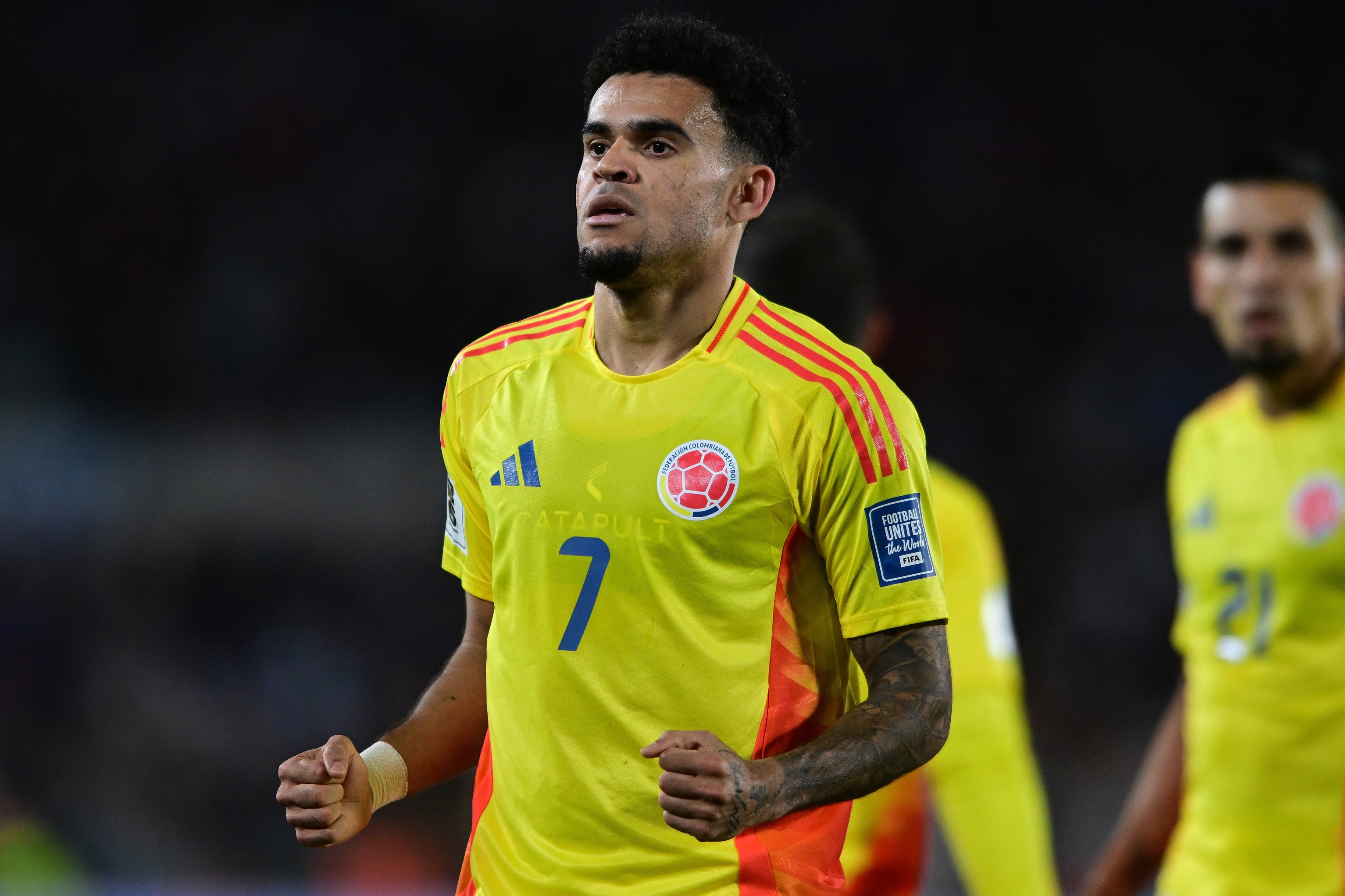Luis Diaz pumps both fists in celebration during Colombia game.