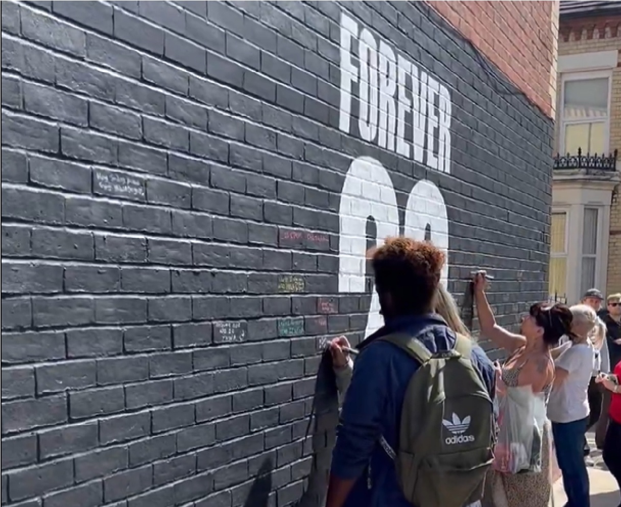 Liverpool fans have been signing condolences for Diogo Jota on a wall near Anfield