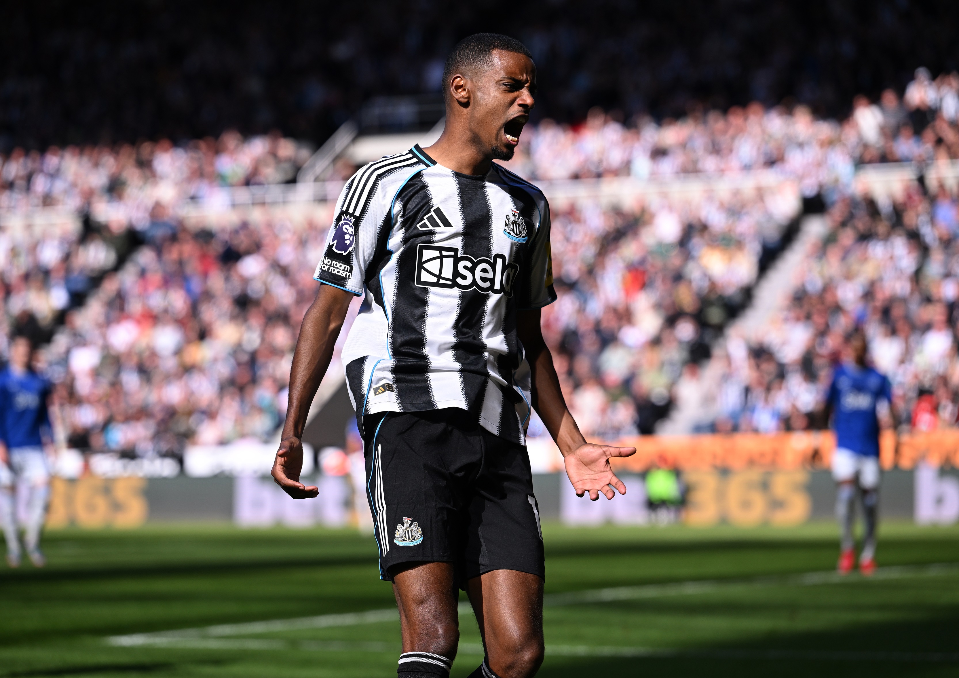 Alexander Isak screams in celebration during Newcastle game.