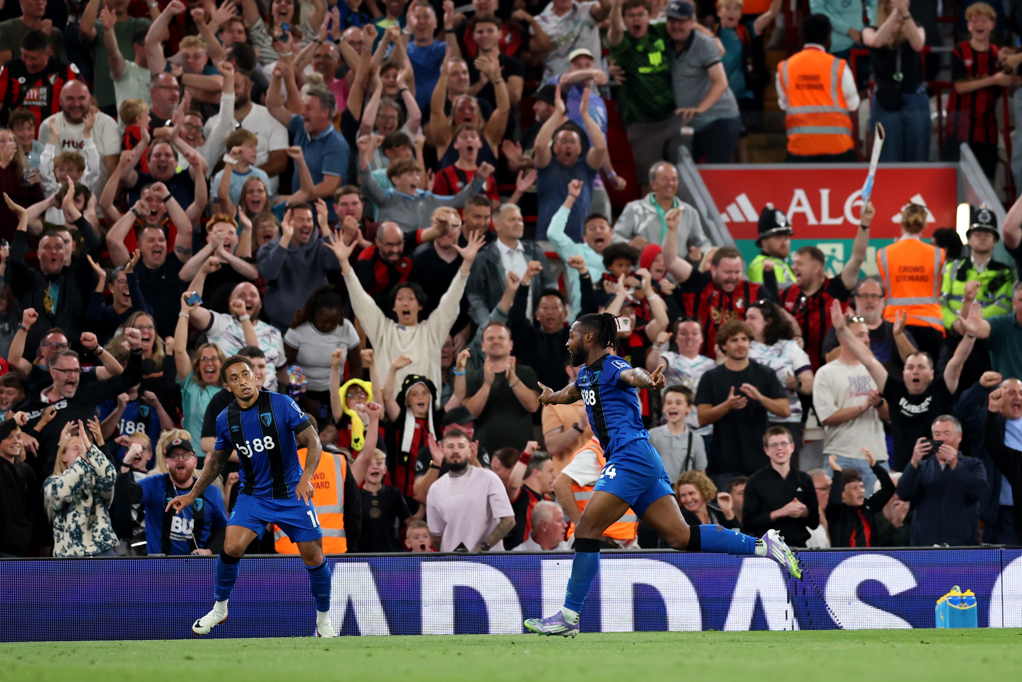 Antoine Semenyo celebrates with Bournemouth fans after scoring against Liverpool.