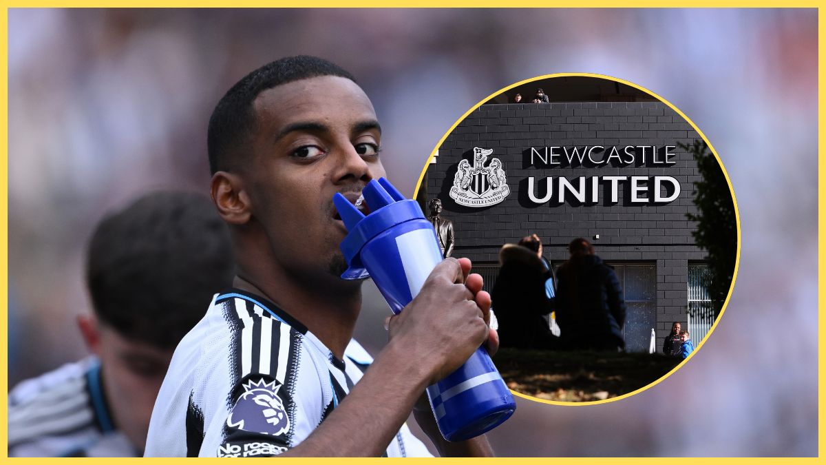 Alexander Isak drinks from a water bottle next to St James Park.