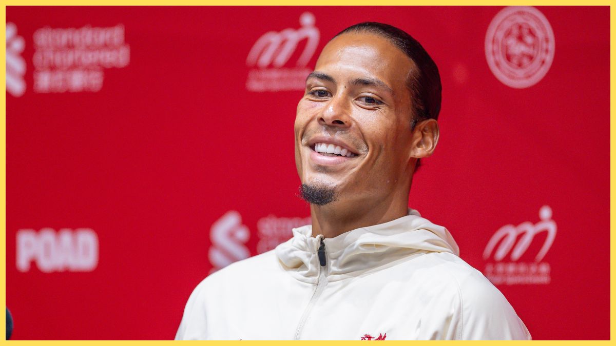 Virgil van Dijk smiles during Liverpool press conference.