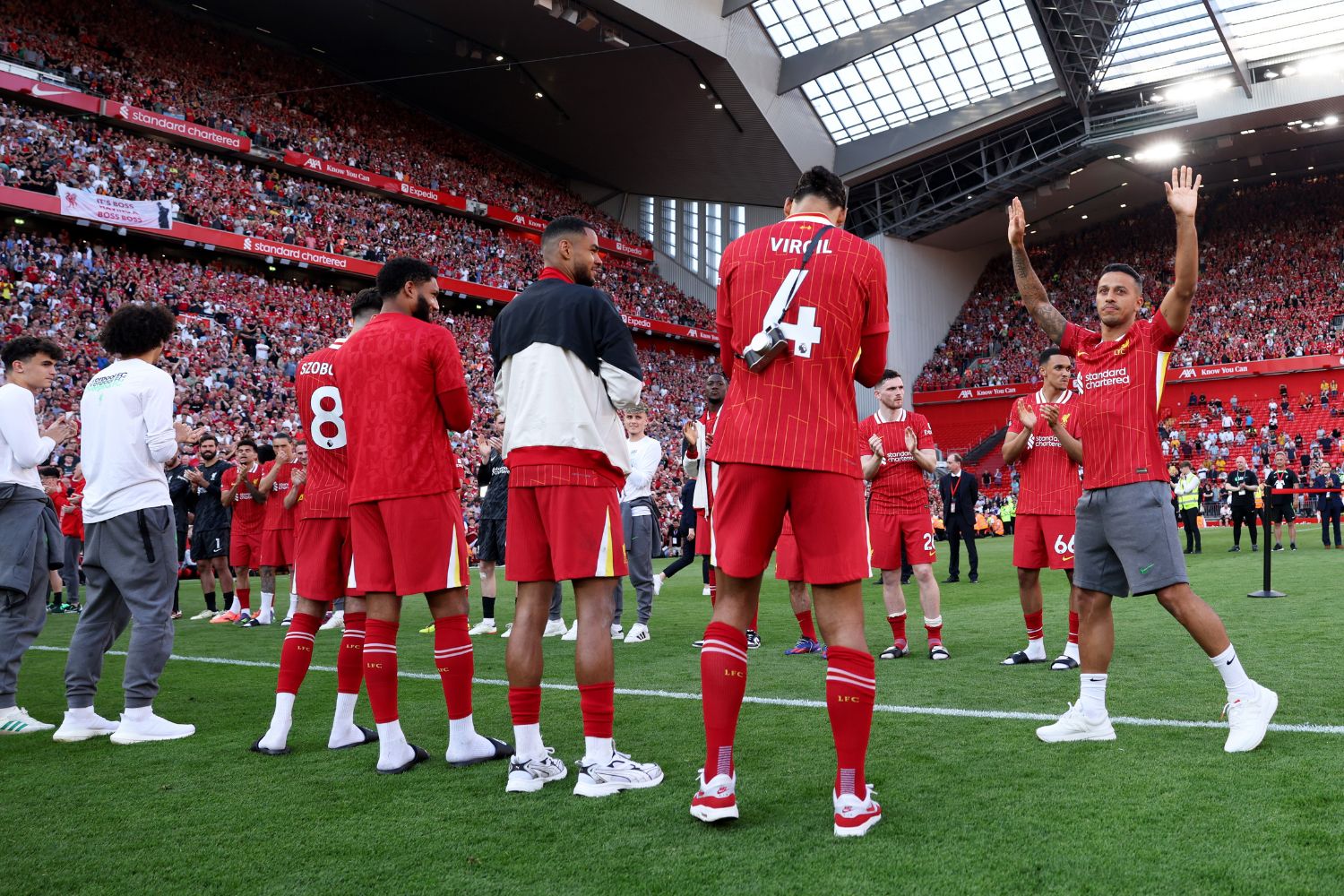 Thiago Alcântara applauded by Liverpool fans and players