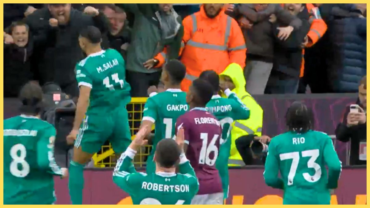 Andy Robertson celebrates Mo Salah's goal