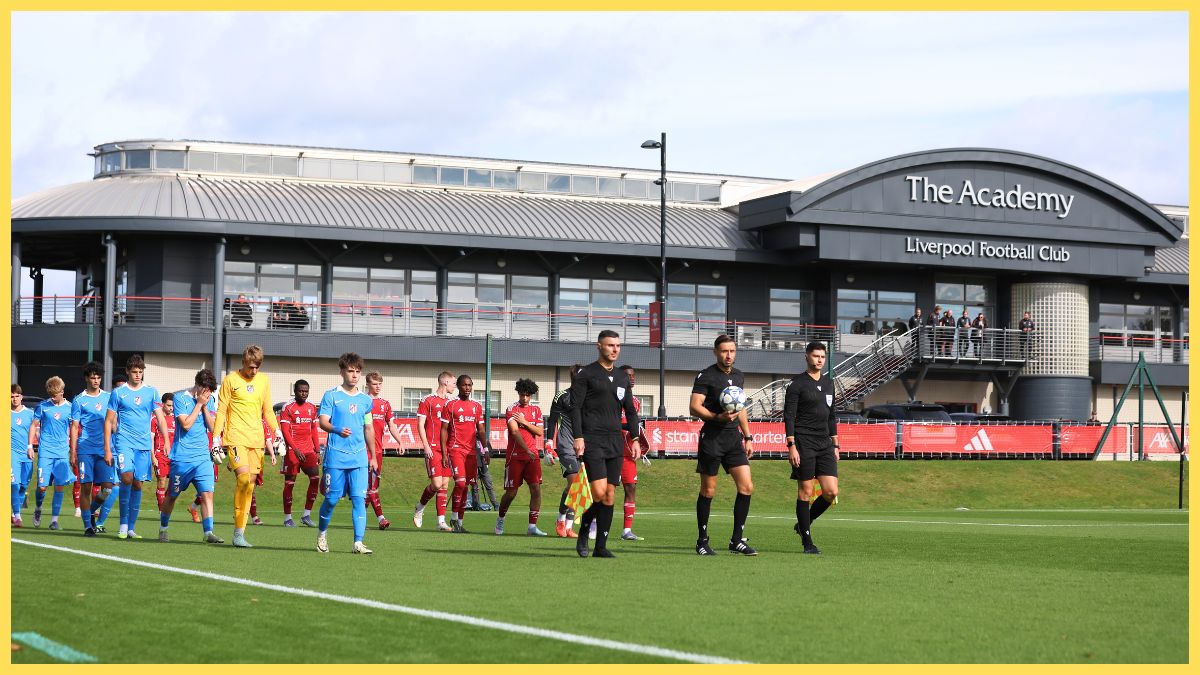 Players of Liverpool and Atletico de Madrid walk out onto the pitch prior to the UEFA Youth League match