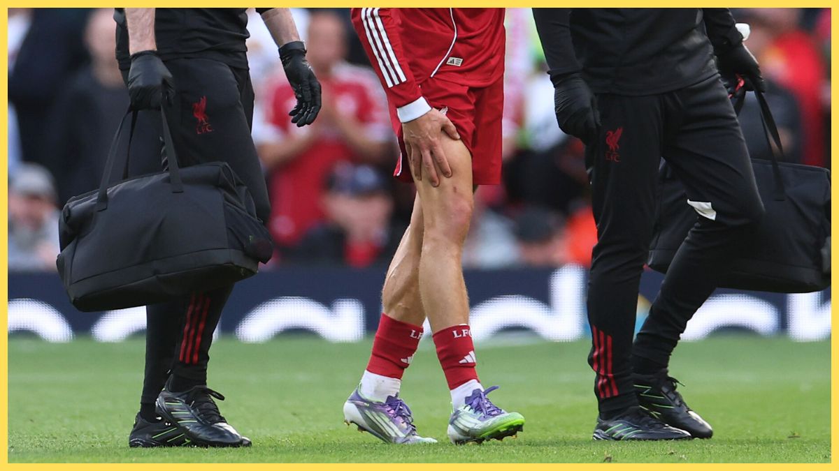 Liverpool trainers attend to injured player