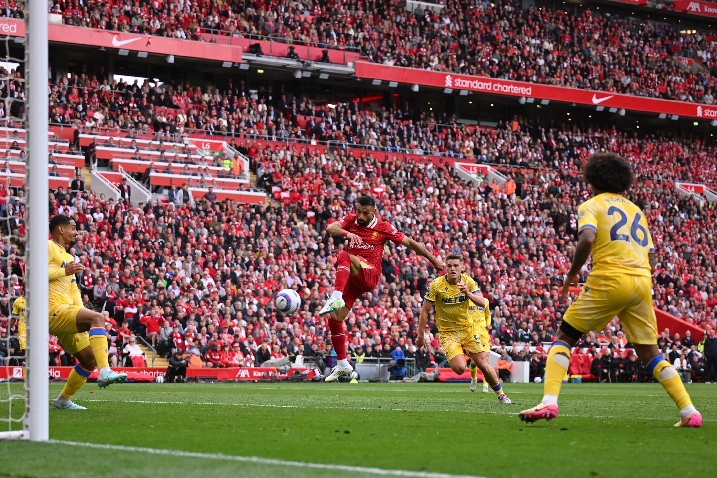 Mo Salah in mid-air after firing a shot against Crystal Palace.