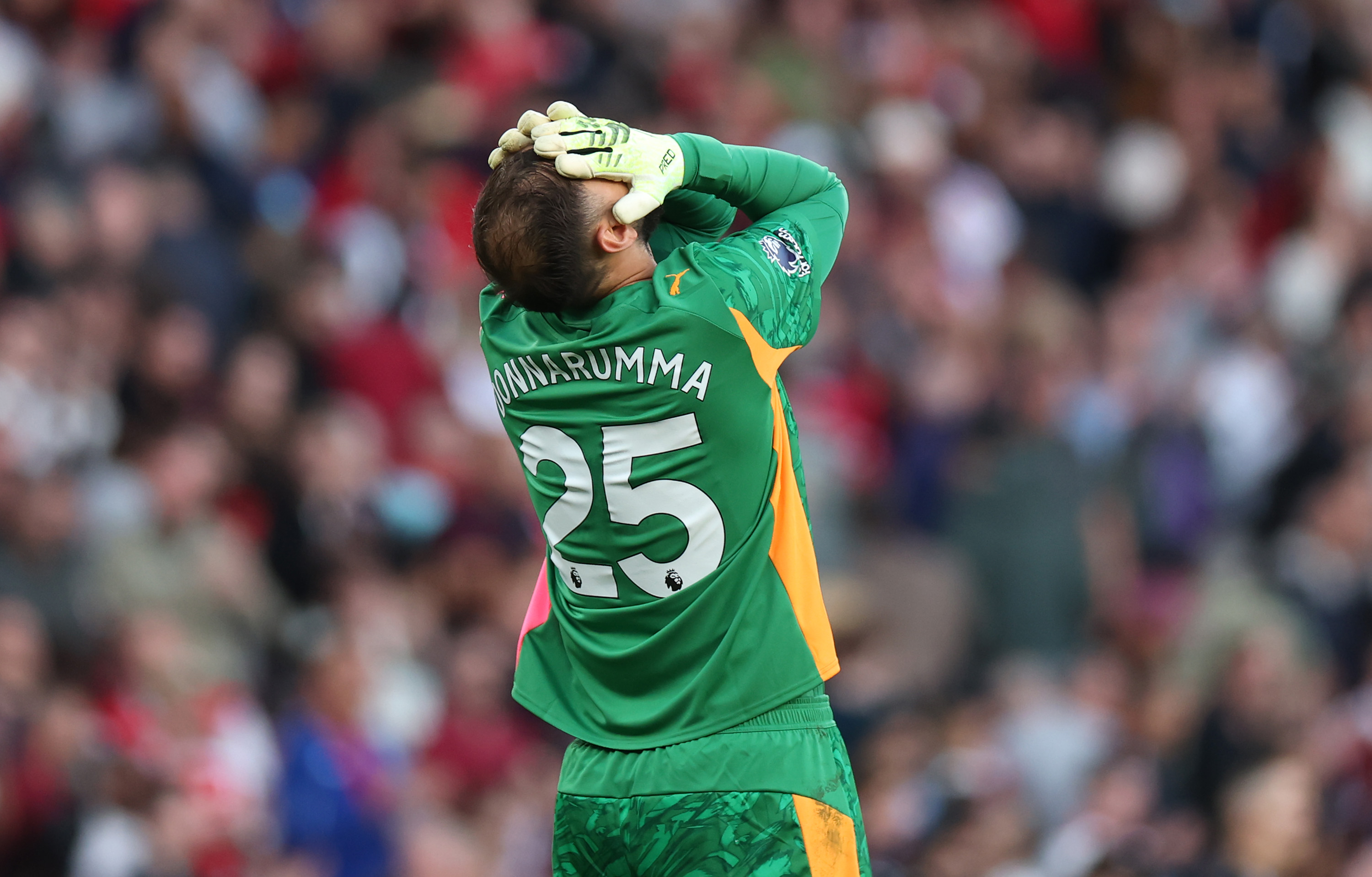 Gianluigi Donnarumma reacts to conceding a stoppage time equaliser against Arsenal on Sunday