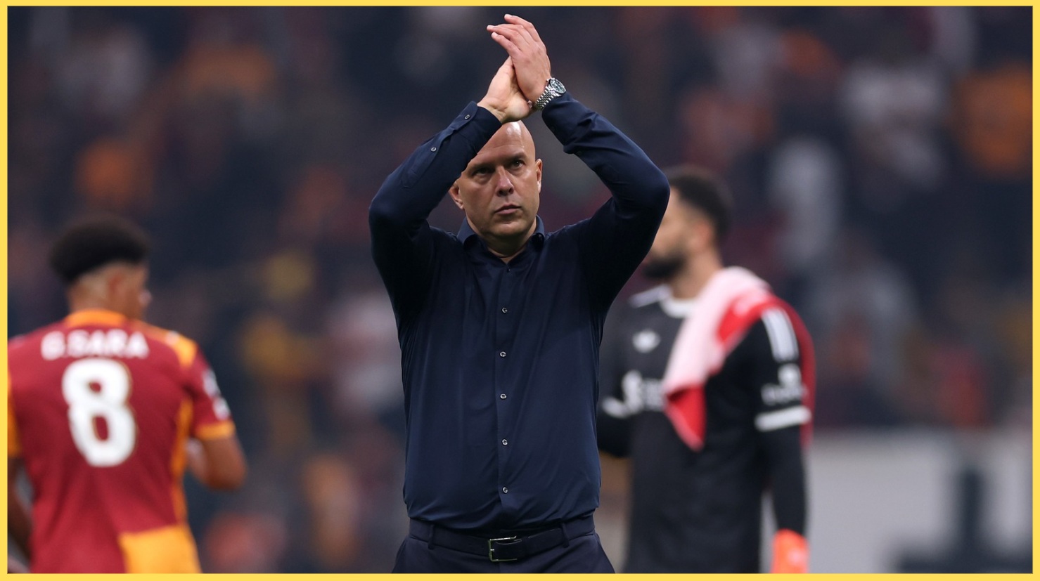 Arne Slot applauds the Liverpool fans after the defeat to Galatasaray