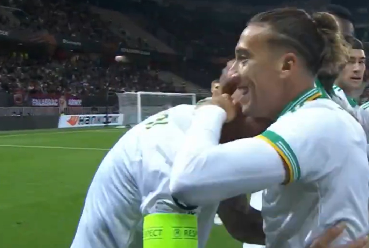 Kostas Tsimikas celebrates with his Roma teammates after setting up Gianluca Mancini to score against Nice