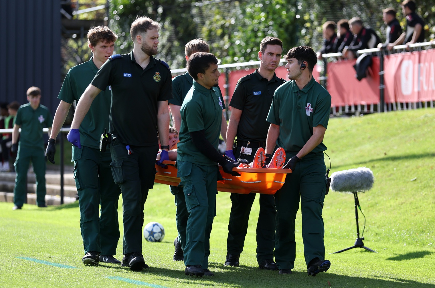 Will Wright was stretchered off with a medial ligament injury in Liverpool U19's draw against Atletico Madrid in the UEFA Youth League