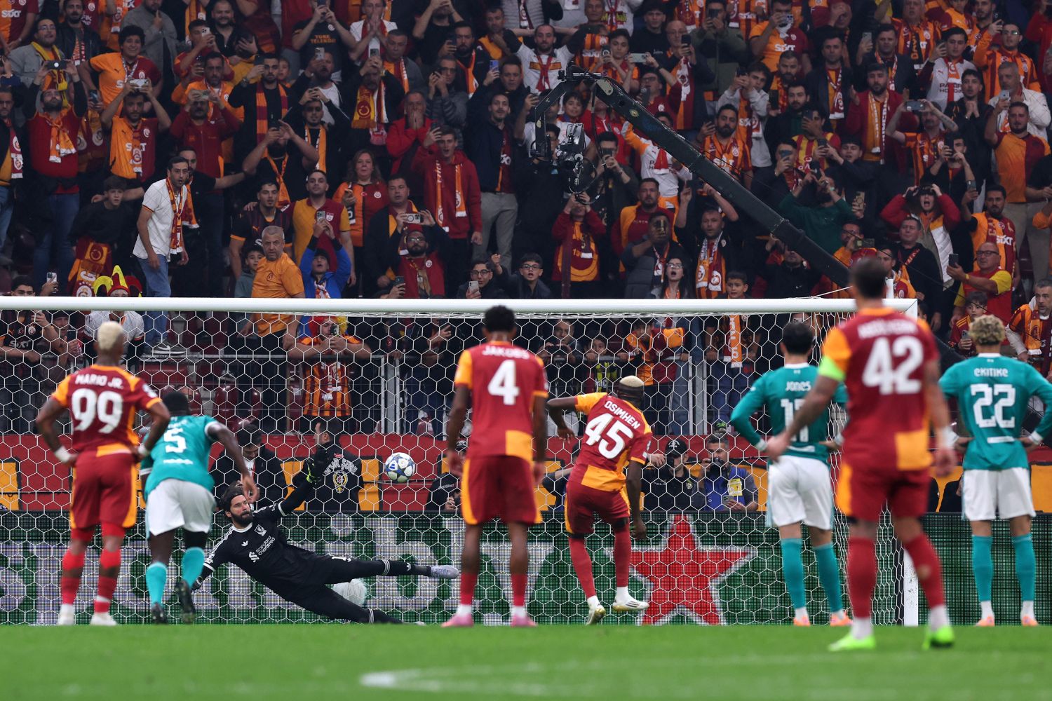 Victor Osimhen scores a penalty against Liverpool