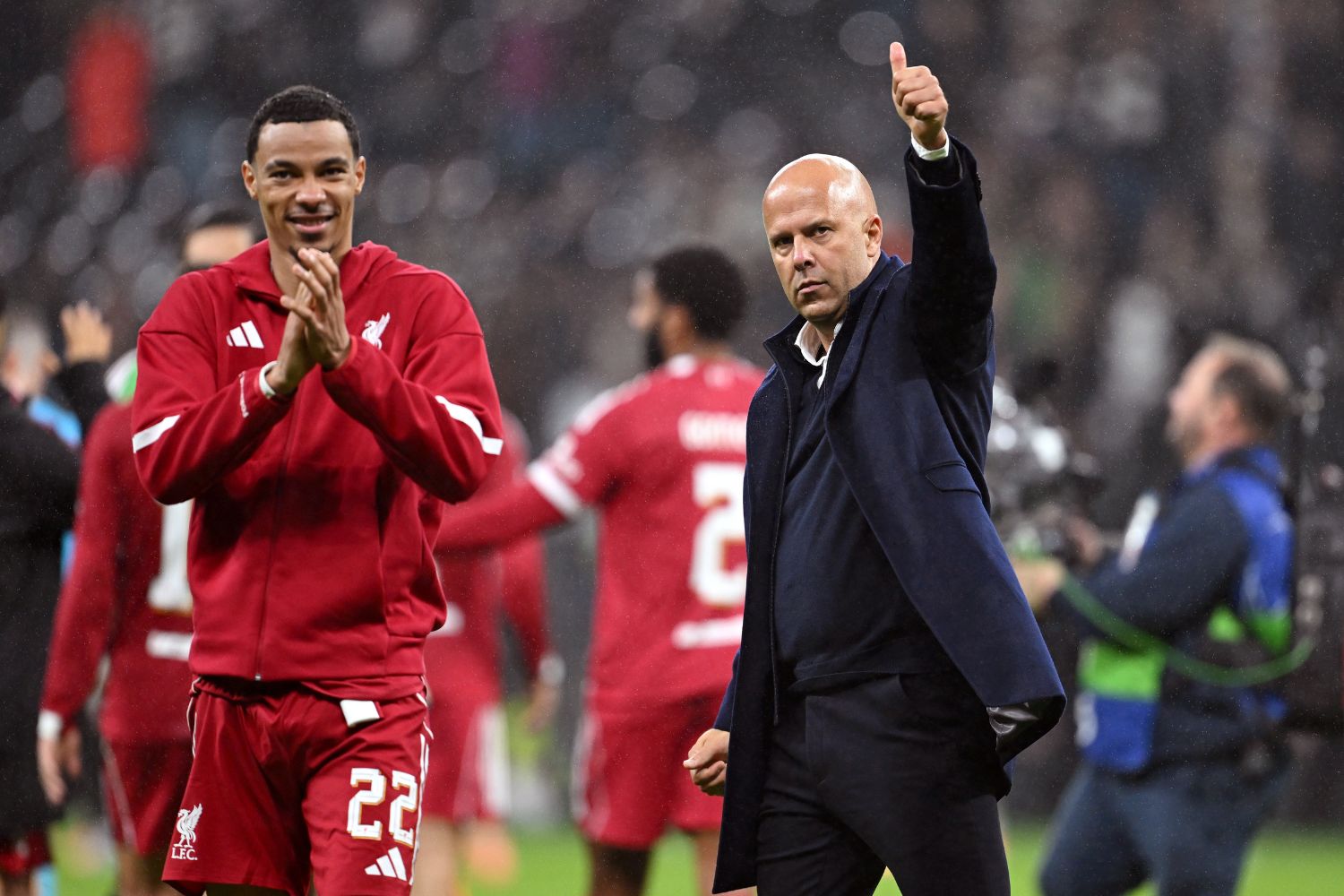 Arne Slot and Hugo Ekitike salute Liverpool fans in Frankfurt