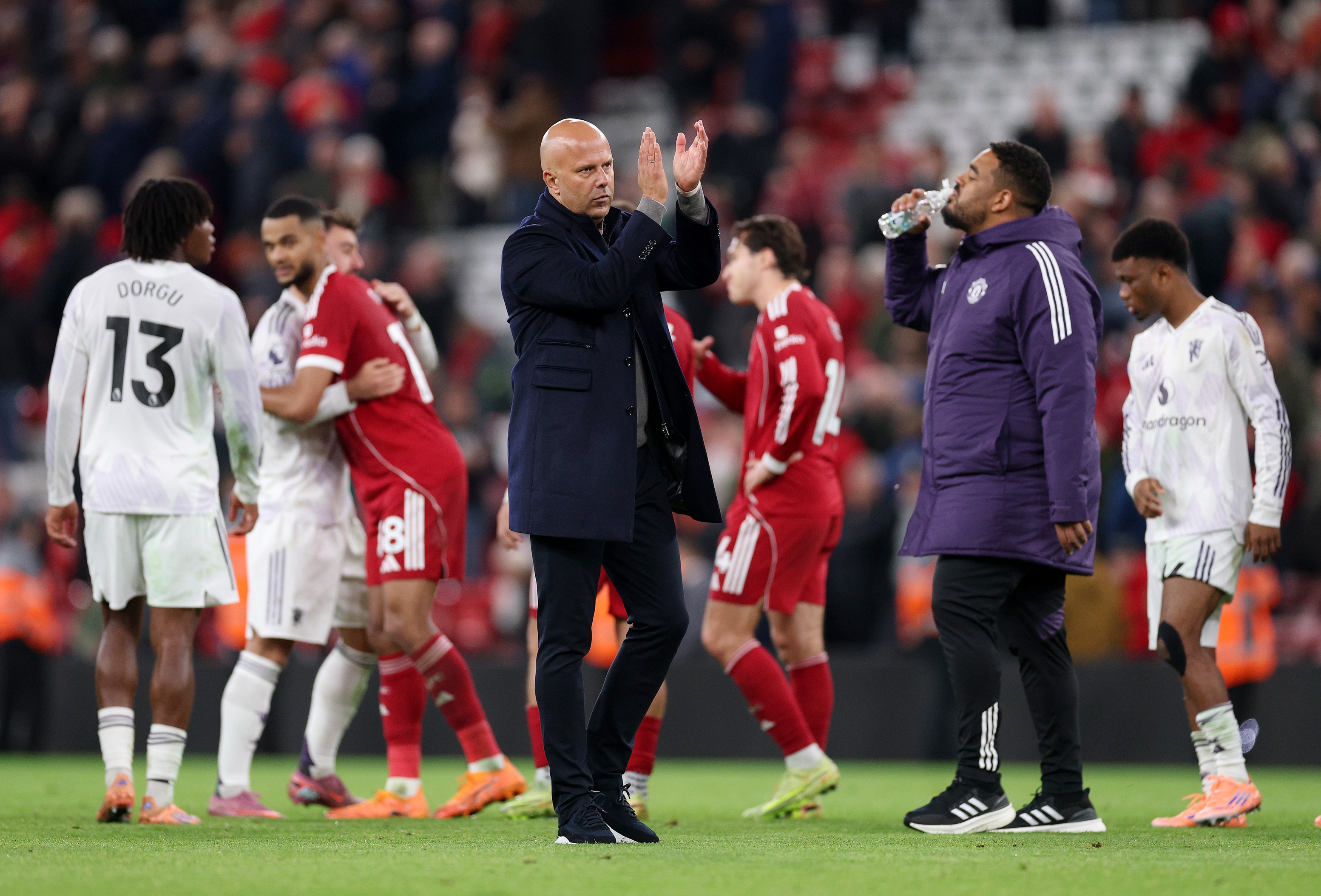 Liverpool head coach Arne Slot claps the fans.