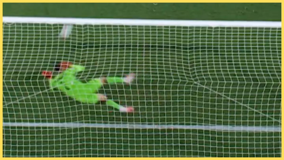 Giorgi Mamardashvili saves a penalty from Ferran Torres