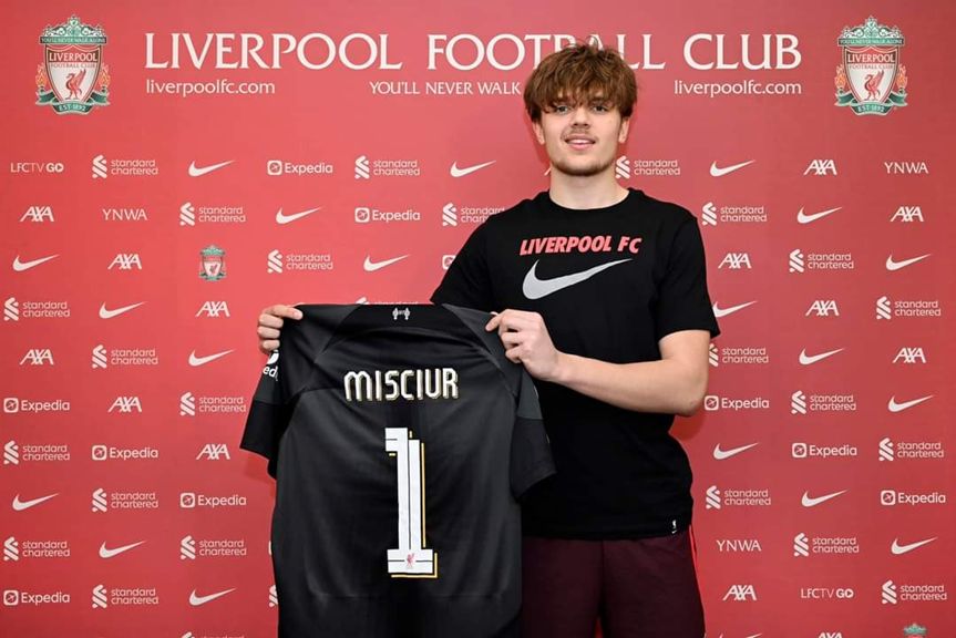 Kornel Misciur holds up his black Liverpool goalkeeper shirt.