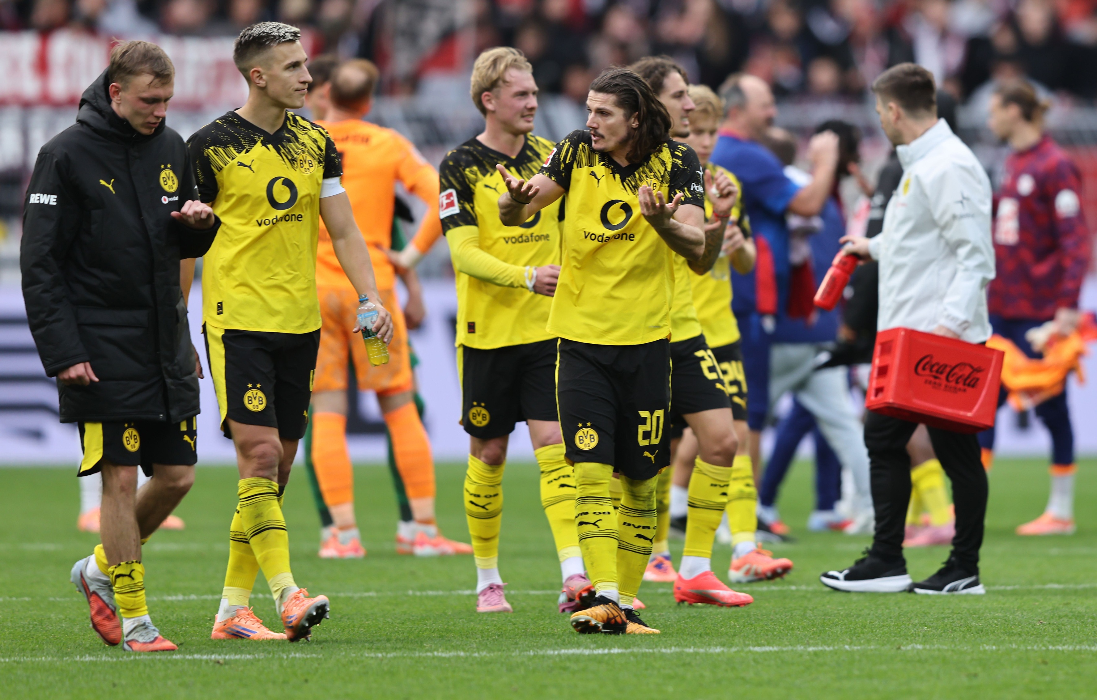 Nico Schlotterbeck walks alongside his Dortmund teammates.