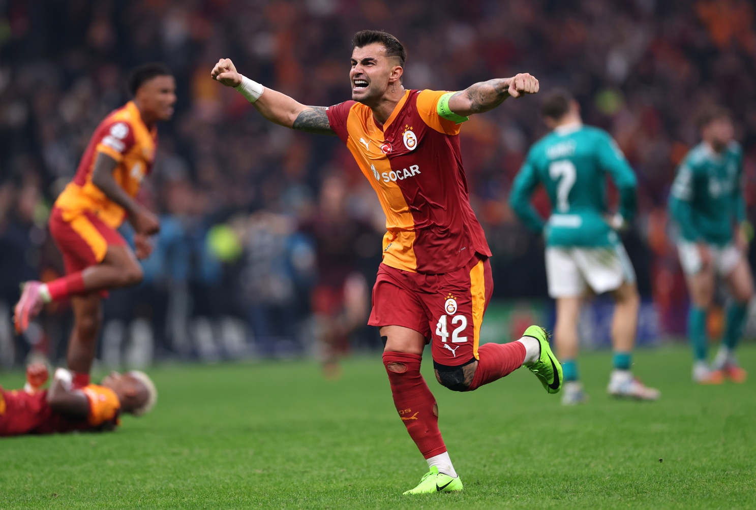 Galatasaray players celebrate their win over Liverpool