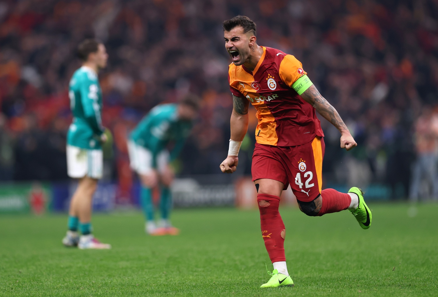 Abdulkerim Bardakci celebrates at the final whistle as Galatasaray beat Liverpool on Tuesday