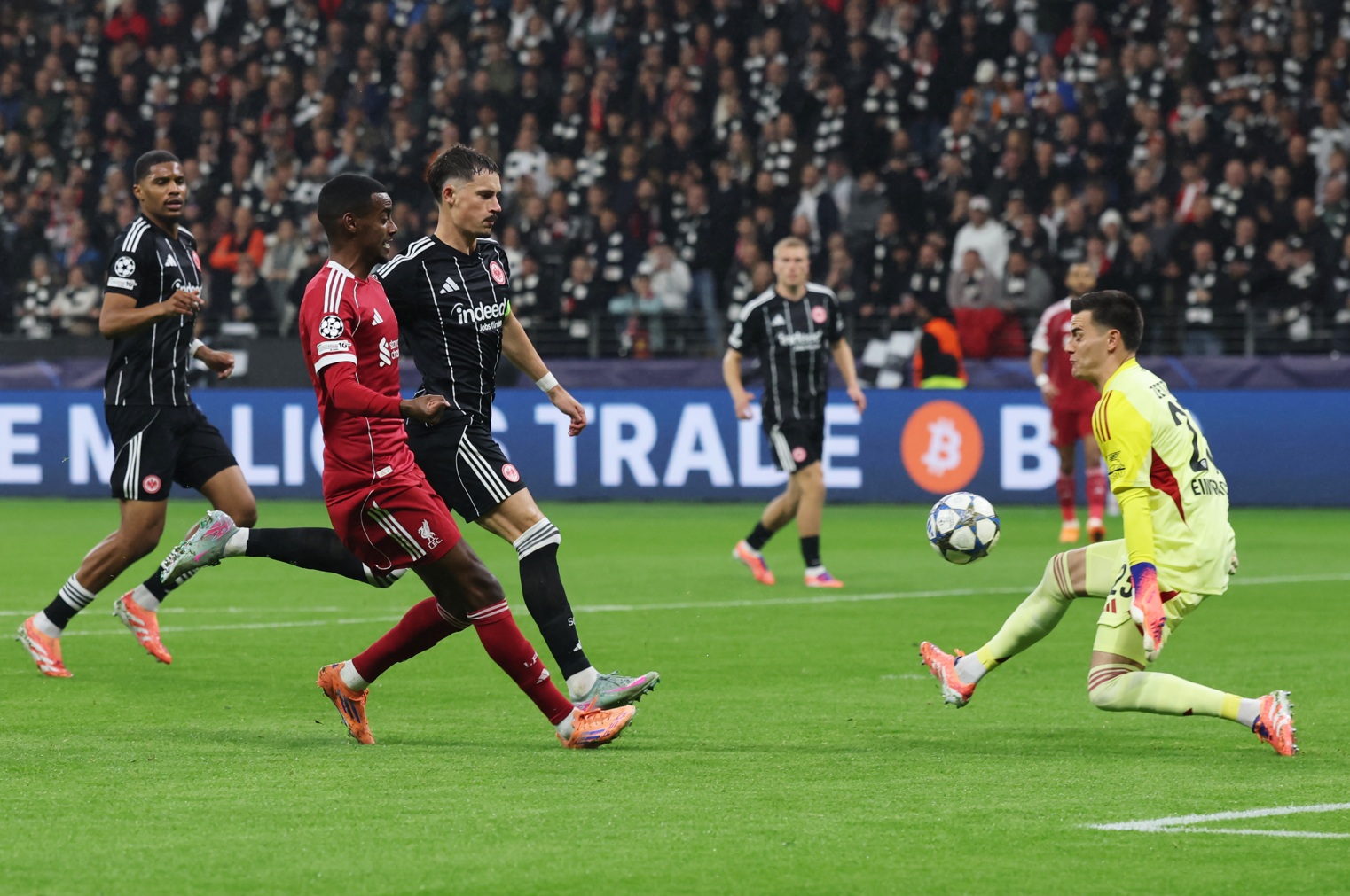 Michael Zetterer of Eintracht Frankfurt makes a save from Alexander Isak