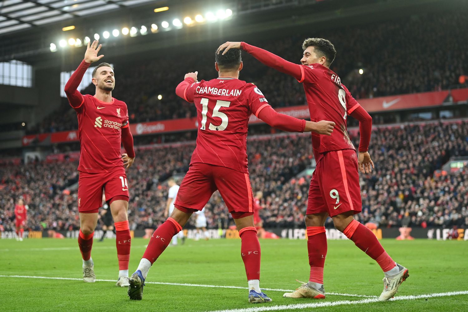Jordan Henderson, Bobby Firmino and Oxlade-Chamberlain celebrate in 2022