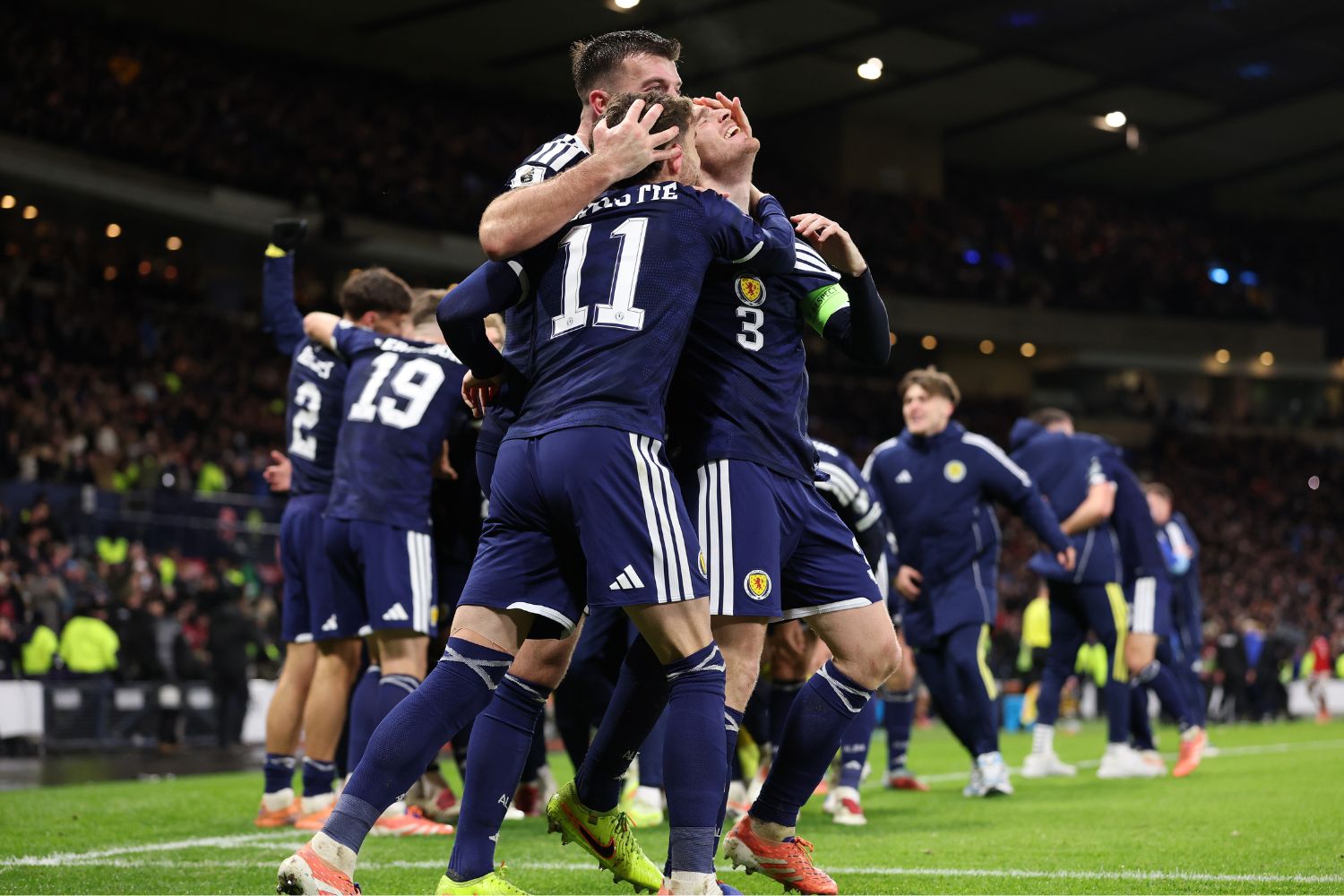 Andy Robertson celebrates with Scotland squad