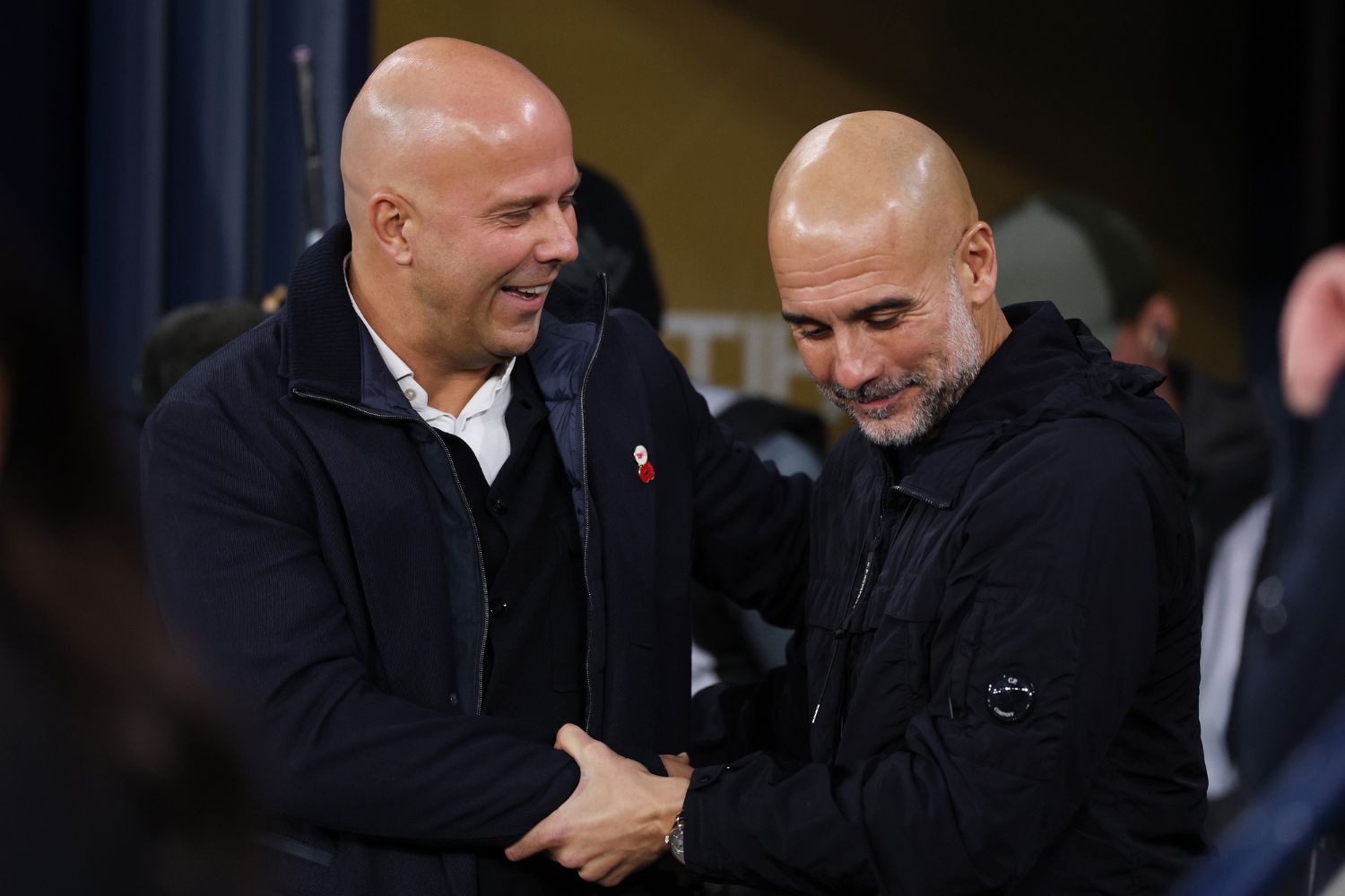 Arne Slot, manager of Liverpool, and Pep Guardiola, manager of Manchester City